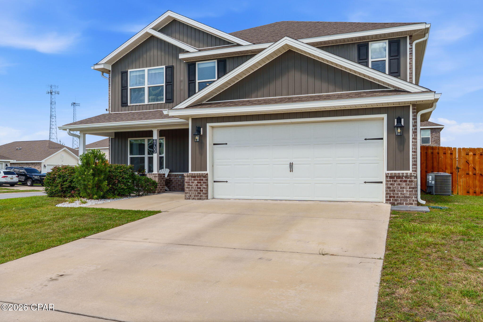 Welcome to 4703 Firefly Lane in Titus Park, where thoughtful upgrades, generous living space, and an unbeatable location come together in one beautifully maintained home.

Built in 2021, this two-story Elle floor plan offers 5 bedrooms, 2.5 bathrooms, 2,840 square feet, and a desirable corner lot. Step inside to a flexible front room that's perfect for a home office, sitting area, playroom, or formal dining space before the home opens into a spacious kitchen, dining, and living area designed for everyday living and entertaining.

The kitchen is both beautiful and functional, featuring granite countertops, a tile backsplash, a large island, Samsung side-by-side refrigerator, upgraded quiet dishwasher, and a pantry with a spring hinge and inset doorknob to help prevent the door from swinging into nearby appliances. Lifeproof luxury vinyl plank flooring runs throughout the downstairs living areas and bathrooms, while the first-floor primary suite offers a spacious bedroom, garden tub, separate glass-enclosed shower, and a bifold barn door leading to the walk-in closet. A conveniently located powder room with an automatic light switch is another example of the thoughtful details you'll find throughout the home.

Upstairs, a spacious second living area creates the perfect space for a media room, game room, home office, study area, or hobby space. Four generously sized bedrooms, a full bathroom, and the laundry room complete the second floor, while ceiling fans in every bedroom add comfort throughout the home.

Outside, the upgrades continue with a two-car garage featuring an epoxy floor, a full brick exterior, oversized gates on both sides of the backyard, and an extended Armorpoxy-coated patio with both covered and pergola seating areas. Premium interior paint, cordless blinds, ceiling fans, full gutters, and numerous owner-added improvements make this home truly move-in ready.

Titus Park residents enjoy a community pool, sidewalks, and dog park, while the location places you less than a mile from Publix, Starbucks, restaurants, gas stations, and everyday shopping. Target is less than 6 miles away, Tyndall Air Force Base is approximately 14 miles away, and Pier Park is about 21 miles away.

If you've been searching for a home with the space of new construction and the benefit of completed upgrades, 4703 Firefly Lane deserves a spot on your must-see list.

*Information is believed to be accurate but is not guaranteed. Buyers should independently verify all measurements, square footage, HOA information, and any other facts deemed important to their purchase.