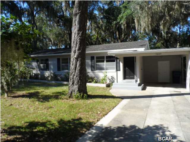 COME HOME to this CLASSIC BRICK COTTAGE, located on a quiet, tree lined street, deep in the Cove.This newly renovated home features many upgrades and modern amenities along with all the charm that you would expect. An open living and dining area make for an inviting entrance with warm tile flooring and abundant windows. The NEW KITCHEN features Custom ''Shaker Style'' Cabinets, Stylish Counter tops with a great Breakfast Bar and New Stainless Appliances. A sunny casual dining area off the Kitchen is the perfect spot for your morning coffee. The Master Suite is located behind original French Doors and includes a totally renovated Bath and Laundry Room. The guest rooms and bath are conveniently split from the Master. The outside includes a large fenced back yard with gated alley access,