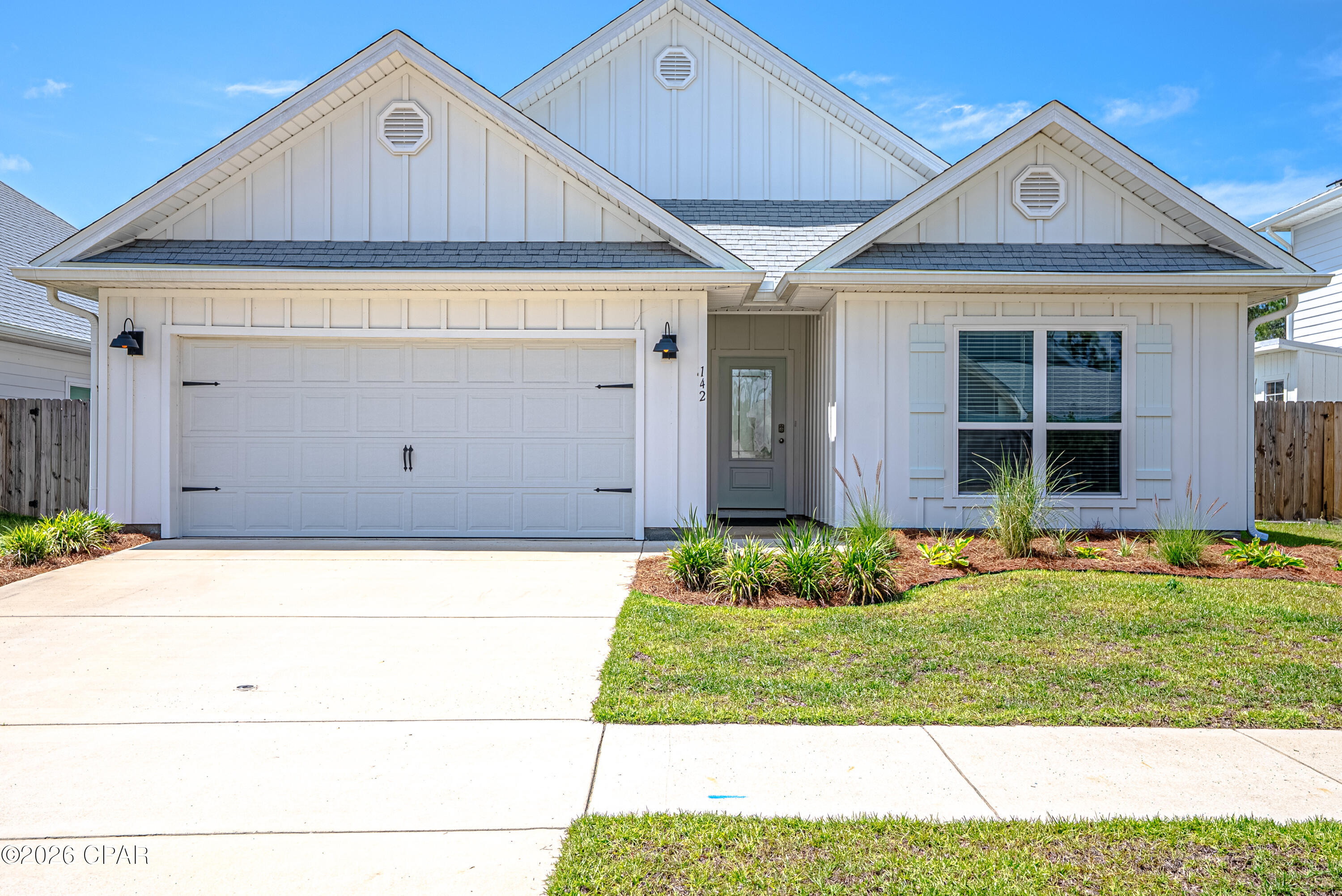 Move In ready! Delray Plan! Welcome to 142 Butler Cove in the Bayside at Ward Creek community, a darling coastal home featuring one of the community's most loved and functional floor plans. This single-story ''DELRAY''model  offers 4 bedrooms, 2 bathrooms, 9-foot ceilings, and durable EVP flooring throughout with no carpet anywhere in the home. The open-concept layout was designed with easy living and entertaining in mind, with the living, dining, and kitchen spaces flowing seamlessly together. The kitchen is full of thoughtful upgrades including granite countertops, a farmhouse sink, stainless steel appliances, and a large island perfect for gathering & entertaining! Right off the living area, you'll find a spacious screened porch overlooking the fenced backyard, creating the perfect spot to relax after a day at the beach! 

Tucked away at the back of the home, the oversized primary suite offers a peaceful retreat with two closets and a beautifully updated en-suite bathroom featuring a modern tiled shower. The split-bedroom layout places three additional bedrooms toward the front of the home, making them ideal for guests, a home office, hobby space, or growing families. The 2-car garage even includes an electric vehicle charging system for added convenience.

Bayside at Ward Creek is a growing community with amenities the whole family can enjoy, including a community pool and playground. Located just minutes from Pier Park, the crystal white sand beaches of PCB, Frank Brown Park, golf courses, Topgolf, Pirate's Voyage, and some of the area's best boating and fishing spots, this location truly offers the best of coastal living! Come see it today!