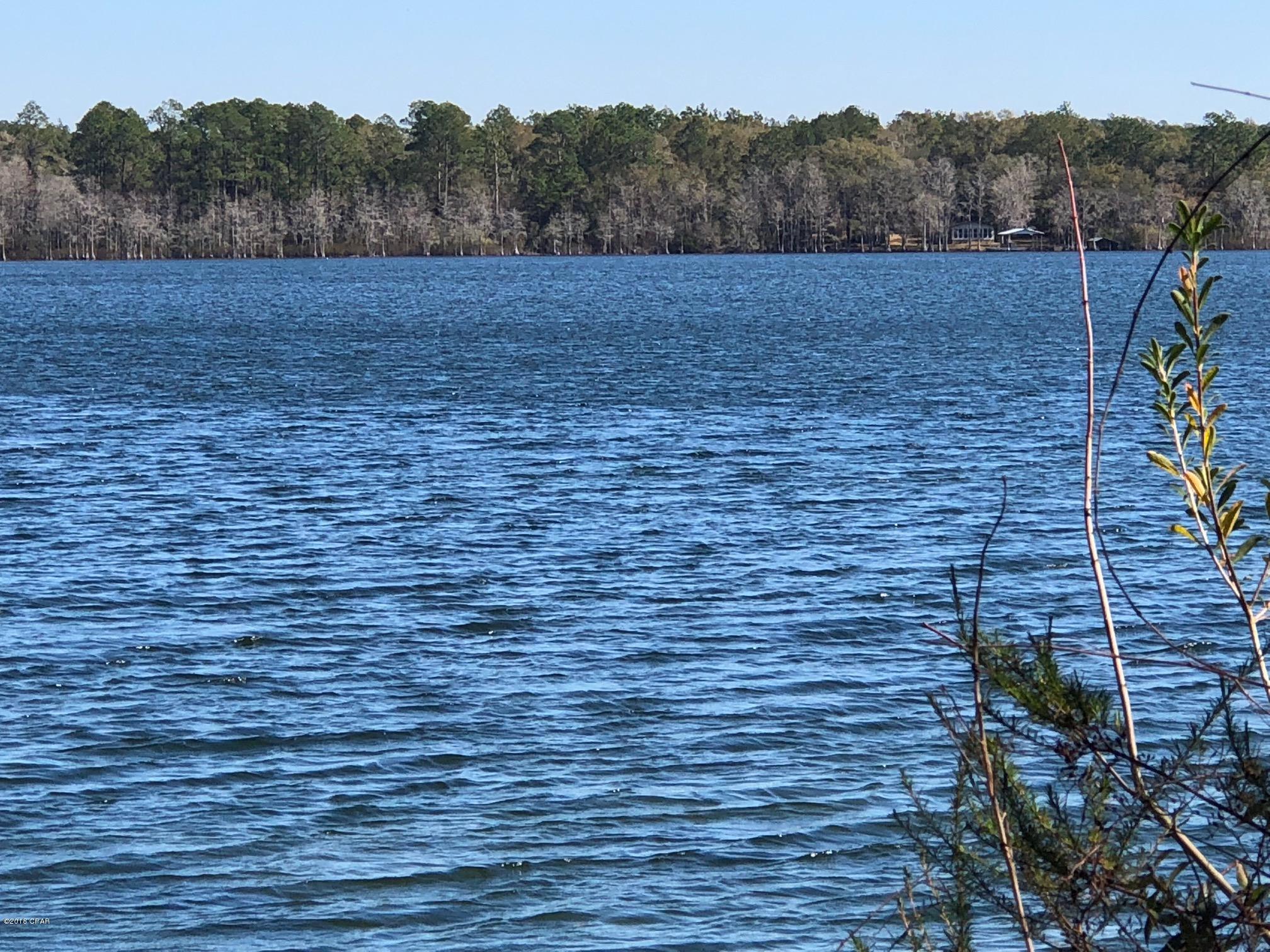 Absolutely incredible waterfront lot on Compass Lake!! Just a touch over 1 acre of land for your Lake House, with 160 feet of waterfront.  Lot is wooded with some beautiful trees perfect for shade on hot summer days.  Compass Lake is considered by many as the premier fresh water lake of the Florida Panhandle.  At approximately 700 acres, there's plenty of room to fish, ski/tube, kayak/canoe, and swim in the clean clear waters of Compass Lake. This property is located approximately 15 minutes South of Interstate 10, just 35 minutes North of Panama City, and 1 hour from the World's Most Beautiful Beaches of Panama City Beach. Don't miss this great opportunity to own your very own waterfront property on Compass Lake!