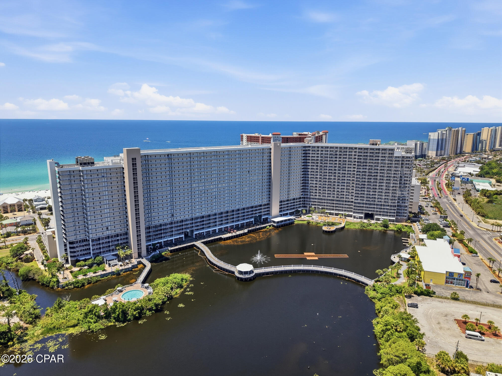 Welcome to Laketown Wharf 1510 -- your elevated escape in the heart of Panama City Beach! This beautifully appointed condo offers the perfect blend of comfort, convenience, and coastal charm, featuring stunning Gulf views and resort-style amenities just steps from the sugar-white sands.

Inside, you'll find a spacious open-concept layout designed for relaxing beach getaways and memorable vacations. The fully equipped kitchen features ample cabinetry, a large island, and Gulf views, creating the perfect space for entertaining and gathering after a day at the beach.

Step onto the private balcony to enjoy morning coffee, breathtaking sunsets, and the sparkling Gulf breeze.

Laketown Wharf is one of Panama City Beach's most sought-after resorts, offering five pools, hot tubs, a Gulf-view fitness center, putting green, kids' playground, covered parking, and a scenic lakefront boardwalk lined with restaurants, shops, and nightly fountain and light shows. Private beach access is conveniently located just across the street next to Pineapple Willy's.

Whether you're searching for a vacation retreat, investment property, or rental-ready beach condo, Unit 1510 offers an unbeatable location, incredible amenities, and strong vacation rental appeal in the heart of Panama City Beach.
