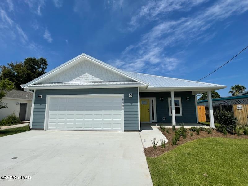 Built in 2021 by Guyson Construction, this furnished South Lagoon beach home offers a turnkey opportunity just minutes from St. Andrews State Park, public boat ramps, dining, and the beach. Currently operating as a short-term rental, the property is well-suited as a primary residence, second home, or investment property.

Inside, the light-filled layout features vaulted ceilings, skylights, coastal finishes, and luxury vinyl plank flooring with a hand-scraped look throughout the main living areas. The open-concept kitchen includes granite countertops, stainless steel appliances, and ample prep and storage space. A split-bedroom floor plan provides added privacy to the primary suite, complete with a walk-in shower and oversized walk-in closet.

Outdoor spaces include a covered front porch, covered back patio, and a large fenced backyard with room to relax or entertain. Additional features include Hardie Board ColorPlus exterior siding, a metal roof, window treatments throughout, and a 2-car garage.

Located in a golf cart-friendly neighborhood with convenient access to two nearby boat launches and the beach, this property combines low-maintenance construction with coastal convenience. No HOA and no flood insurance currently required. Buyer to verify all measurements, rental restrictions, and insurance requirements if important.