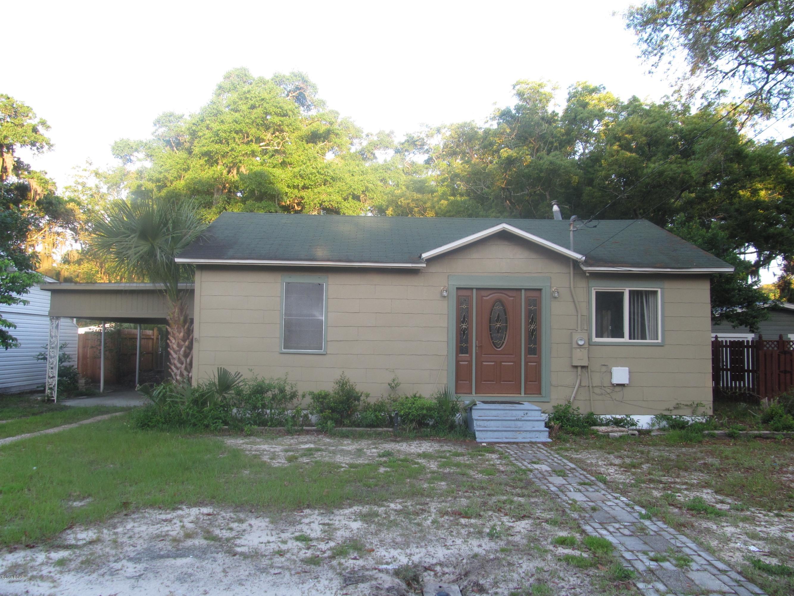 2 bedroom 1 bath home with a covered 2 car carport.  This home has an open floor plan, vaulted ceiling, breakfast bar and backyard brick fire pit.