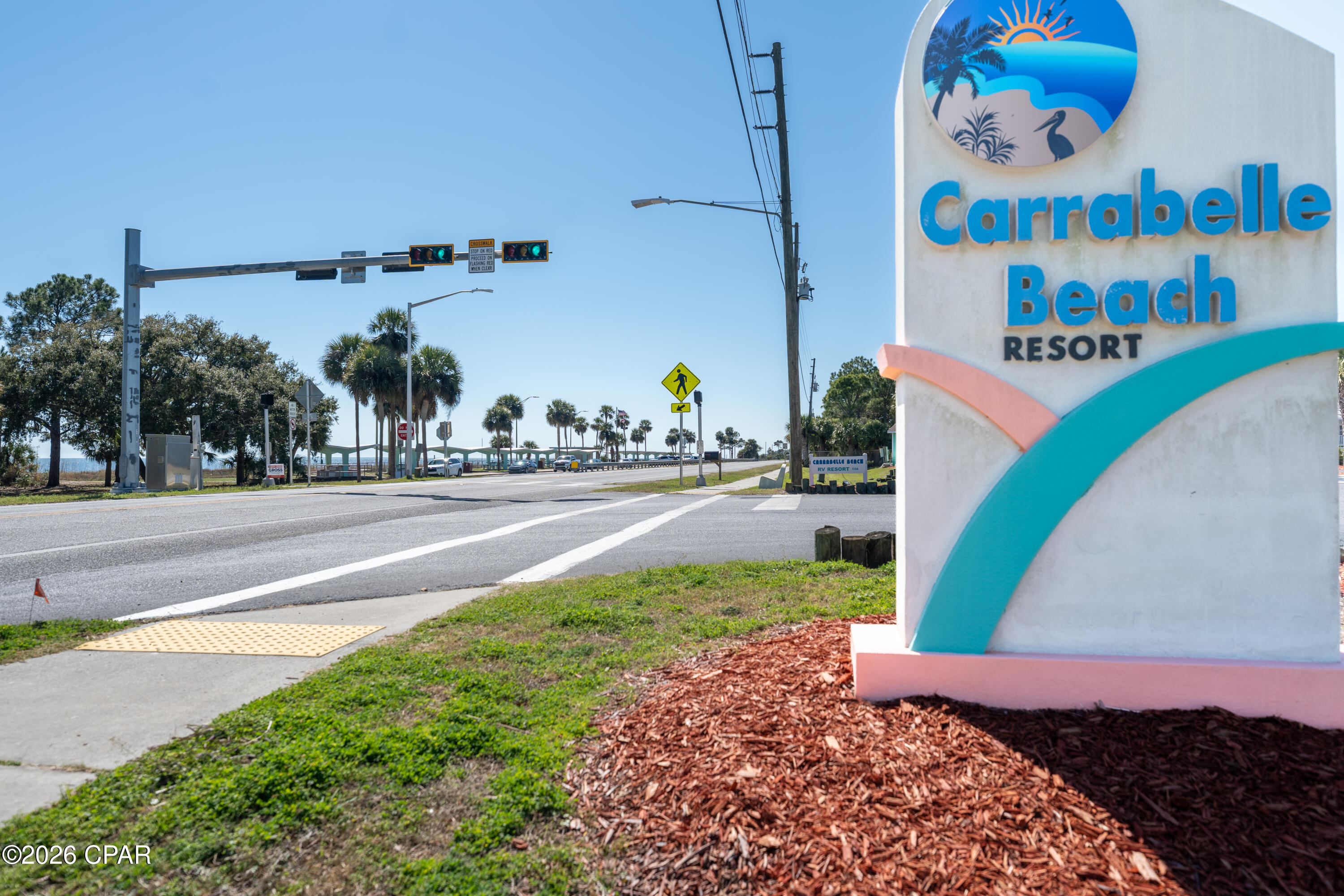 Carabelle RV Resort end spot.  This back in space has a swing, grill, and table.  Lush landscaping and close access. to the amenities including pool, laundry, playground, store, and owners lounge.