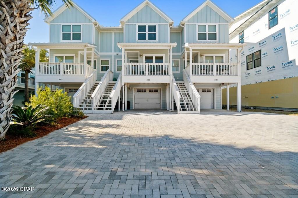 ATTENTION BOATERS AND FISHERMEN! CANAL FRONT, BEACHSIDE TOWNHOME WITH COVERED BOAT SLIP! Don't miss this rare opportunity to own a canal-front property on the beachside of Hwy 98. This beautiful 3 BR/3.5 BA townhome is located a half block from the beach, making it perfect for the fisherman and family! The townhome is beautifully furnished with high-end furniture, making it truly turnkey. The first floor features the garage, perfect for parking or storing fishing equipment and beach gear, and the first bedroom, which is an ensuite with access to a private porch overlooking the canal, that features a storage closet suited for an ice maker/freezer, or perfect for holding rods. The main floor features a kitchen with custom cabinets, quartz countertops, and stainless steel appliances, a living room with shiplap walls and a covered balcony, a powder room, and the laundry room, which features an LG washer and dryer. The top floor features the master suite, with dual vanities, an oversized walk-in shower, and a private balcony perfect for watching the boats come by, and an additional bedroom with its own bathroom and a private balcony. The amenities of the property include a personal covered boat slip with a 16,000 lb lift, great deck space, and an 18x20 garage. Being on the beach side eliminates the worry of having to go under the Hwy 98 bridge, which is perfect for anyone with a tower. Don't miss this rare opportunity! Check out the virtual tour.