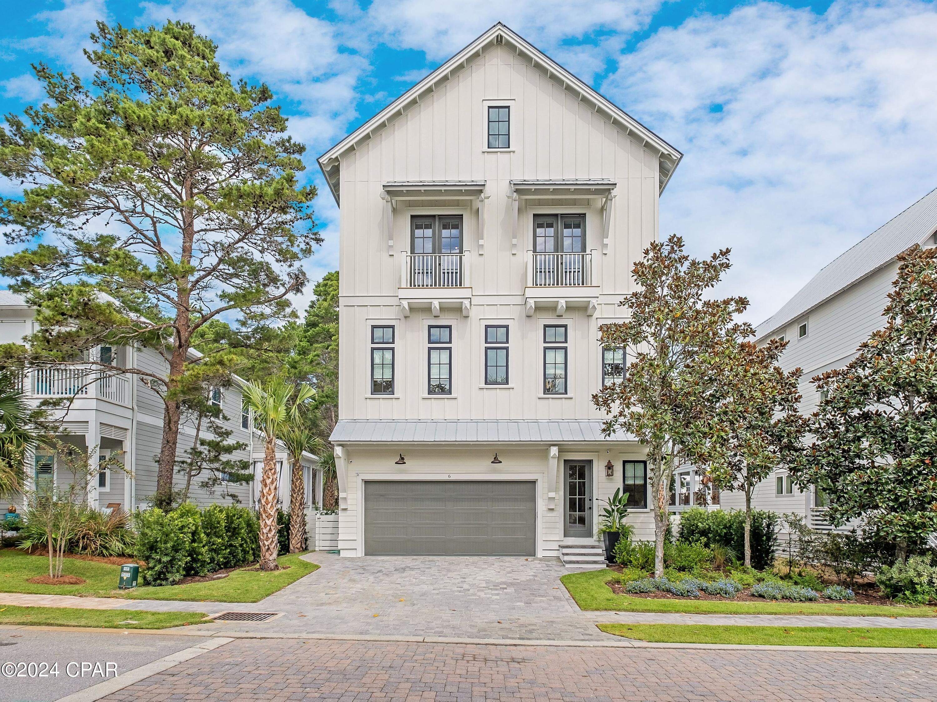 Recent appraisal on file at $2,315,000. Artistically marrying coastal design with contemporary luxuries in a developed waterside community, this four story, 3,578 square foot home by 30A Builders encapsulates elevated construction with total livability. Located near the community pool, clubhouse and kayak launch, this property gifts future owners and guests views of Lake Powell and plentiful spaces for work, play and relaxation. The first level of the home welcomes with shellstone floors, custom artwork nooks with lighting, and a three stop elevator. A private flex room, ideal for a bunk space, home office or ground level sitting area  provides convenience as well as direct access to the backyard oasis. Featuring lush landscaping, a large private pool and artificial turf, the fully fenced backyard is perfect for soaking up the sun or enjoying sunset with friends and family. A guest room and shared full bath provide additional accommodations on the first floor.  Featuring a reverse floor plan, this new construction home offers a modern chef's kitchen, glass front butler's pantry, wet bar, dining and living room, all flooded with natural light thanks to floor to ceiling large panel windows. The black ZLine gas range and white oak cabinet doors add a touch of organic refinement to the spacious layout, while additional seating around the eat-in island and outdoor seating on the second level covered porch provide endless opportunities for transitional living. The second level of this home also offers a curated full bath and guest bedroom with oversized windows, ample sized closets and designer fixtures. The third level features a primary suite with freestanding tub, oversized walk-in shower and custom plaster vanity, and walk-in closet. The third floor balcony is also off the primary suite, providing a transitioning living space filled with privacy and lake views. A full bath, guest room, laundry and bunk room are also provided on the third level alongside a cozy living space with beverage bar. The fourth level provides an additional flex space plus access to the top level living deck with summer kitchen, covered dining space and endless open area for entertaining and relaxing, all with direct views of Lake Powell. Elevator for easy access to all floors. Home can be sold furnished, contact Listing agent for further details.