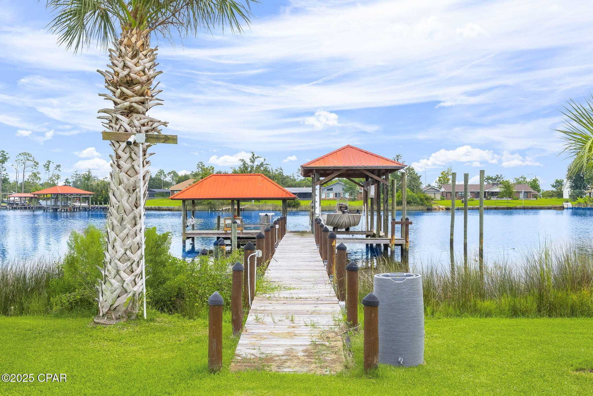 Back on the Market due to no fault of the property.
Welcome to 7122 Bay Crest Rd.!  Here's your opportunity to own this wonderful Water Front Home, your new Florida Coastal Oasis! This home is nestled on shores of Gainer Bayou with direct access to North Bay and then to St. Andrew Bay or the Gulf for all your Salt-Water boating activities! 
This location is conveniently located with access to the airport in about 15 minutes, beautiful sandy white beaches of Panama City Beach in about 25 minutes, Tyndall AFB in about 30 minutes, and you'll be shopping in Lynn Haven in 10 minutes! 

Situated on .725 acre, fully fenced, this property offers 100 ft of waterfront with a covered fishing dock with fresh water and electricity, low voltage lighting, fillet table, rigging station and rod holders. Next to this is the covered boat dock with lift, and another boat docking space next to it. Closer to shore there is a platform where you can access/park your jet skies or kayak!
Next you'll find the detached studio, mother-in-law or guest quarters which also has a nice deck facing the water and includes living/dining/kitchen area, bedroom, and bath!
Moving on, you will find a nice relaxing saltwater pool, a large open deck and nice screened in room. The perfect place to sit and enjoy the shimmering waters and natural beauty this property has to offer!  
The home is approximately 2329 sq ft. featuring an amazing great room with a wall of windows overlooking the beautiful backyard and water views, this is open to the spacious living room with a wood burning fireplace and built-in cabinets and shelves, and to the kitchen and dining area with granite countertops, stainless steel appliances and a nice island for easy dining or prep space!  As you enter the home you will see a large foyer area that could easily be used for you additional space needs.  Go to the left and you will have the guest bath and a large guest bedroom (this was 2 bedrooms and can be converted back if needed). 
Wake up to breathtaking views every morning from the primary suite with double doors leading out to the back deck overlooking the pool and the Bayou! The primary ensuite features a double sink vanity, separate shower and jetted tub!
The laundry is located in the hall adjacent to the kitchen, and the garage has a workshop with a/c.  There is covered parking as well that can easily accommodate 2 large vehicles located in front of the garage.  You will also have a separate 10 x 20 storage building with loft shelves on each end of the building.
There are many more features to this home you will surely love so call your favorite Realtor today to schedule your private showing!
Thank you for considering this incredible property!  All information and measurements should be verified by buyer or buyer's agent if important.