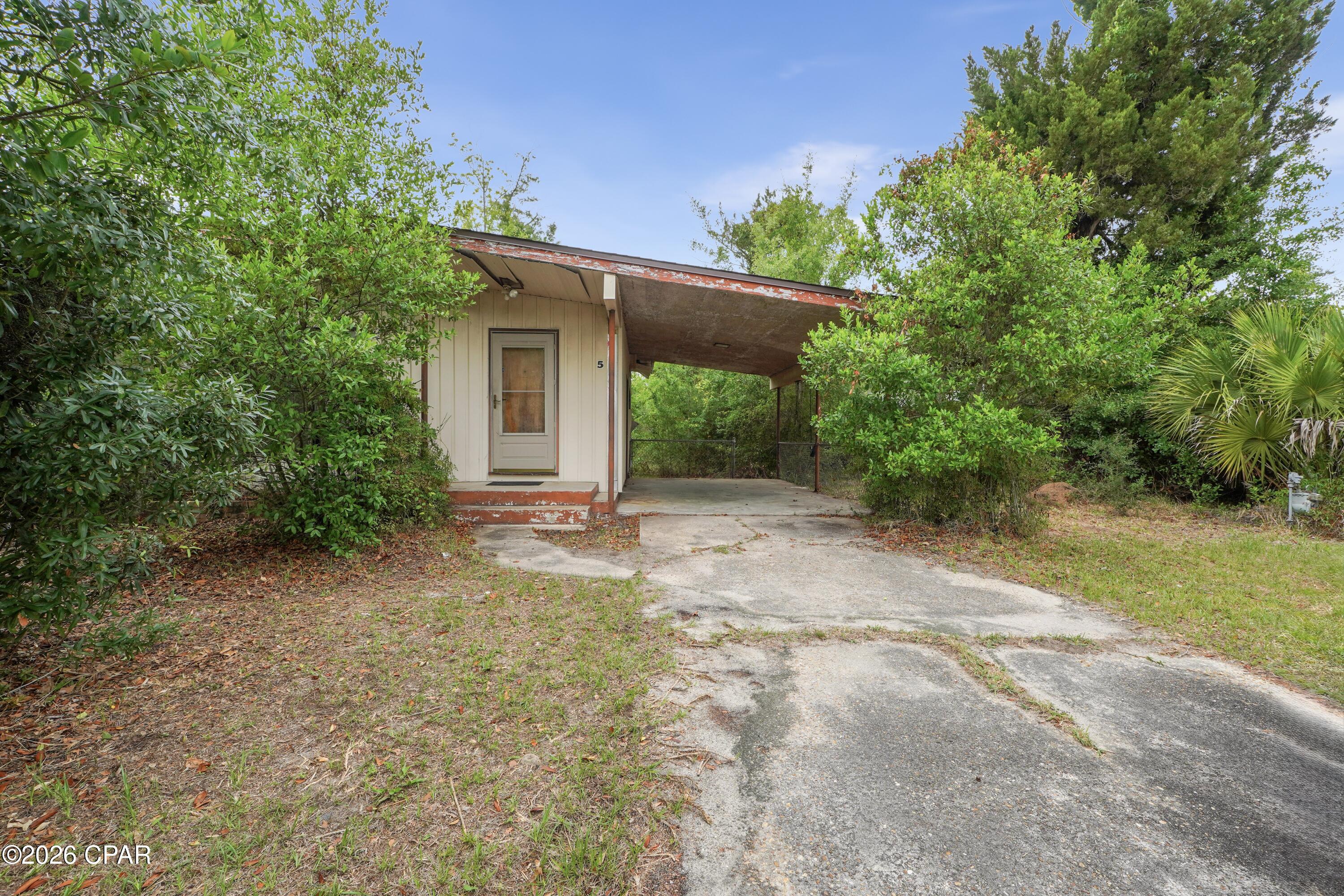 Rare Opportunity, 3.94 acres, zoned R-1 and R-2 available for development. Fixer-upper home is on the property. Home has new roof installed after Hurricane Michael. City water and sewer available. Close to the water for fishing and boating. Close to schools, shopping, grocery, restaurants, and Gulf Coast Regional Medical Center.