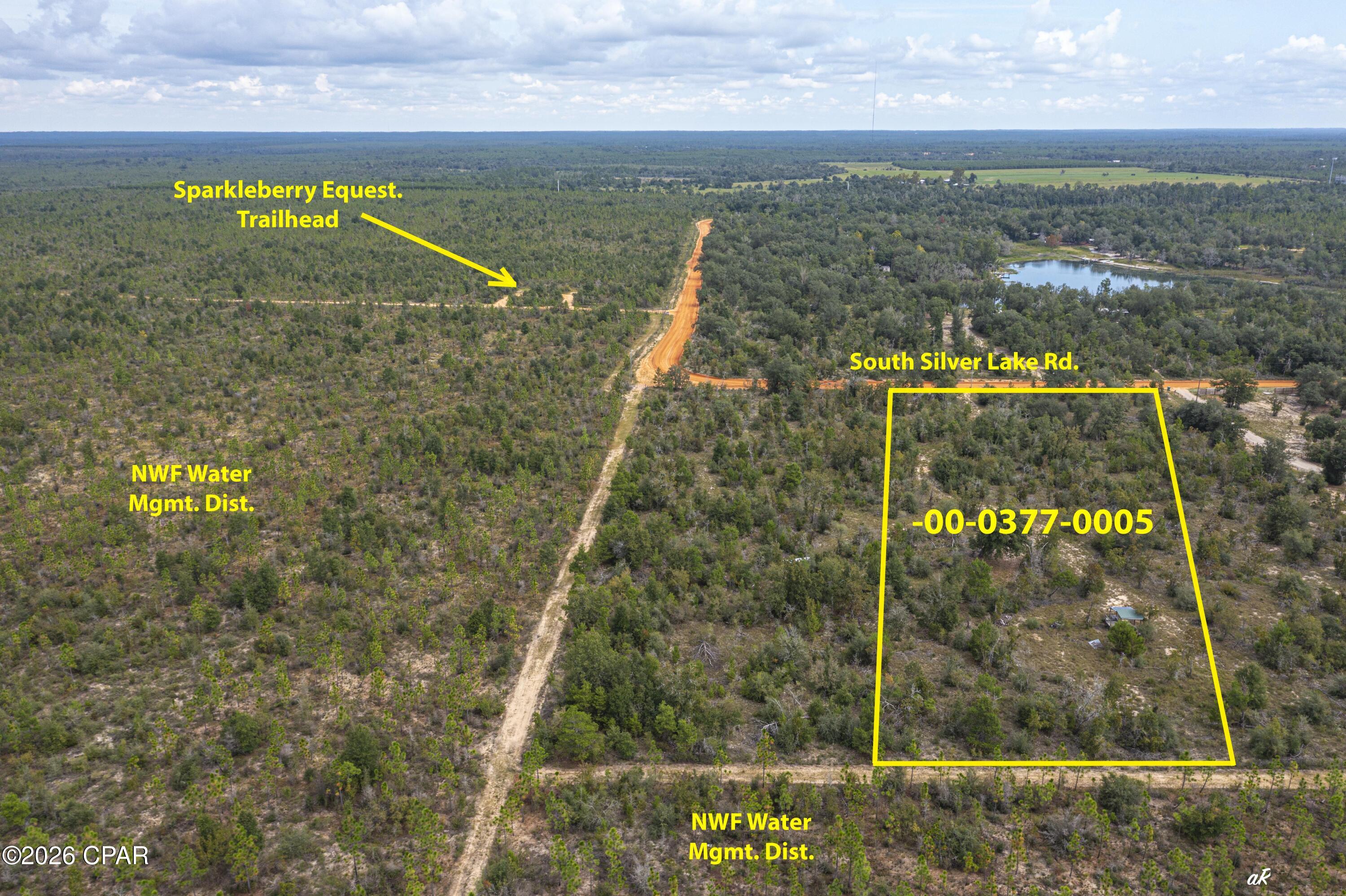 If privacy and seclusion are at the top of your list, this property delivers. This beautiful homesite spans approximately 165 feet wide by 660 feet deep, offering plenty of space to spread out and enjoy the outdoors. Direct access to endless recreation, hunting, horseback riding, hiking, and exploring right from your own backyard.

Step out your front door to saddle up and ride straight to Econfina Creek or Sparkleberry Pond for a true North Florida experience. The property is located on a county-maintained road just one mile from pavement, providing the perfect balance of accessibility and privacy. Plus, it's high and dry and ready for your vision.

Conveniently located just 6 miles from grocery and hardware stores and only 30 miles from Northwest Florida Beaches International Airport, you'll enjoy peaceful, rural living without sacrificing everyday necessities.

This is your chance to own a private slice of North Florida paradise.