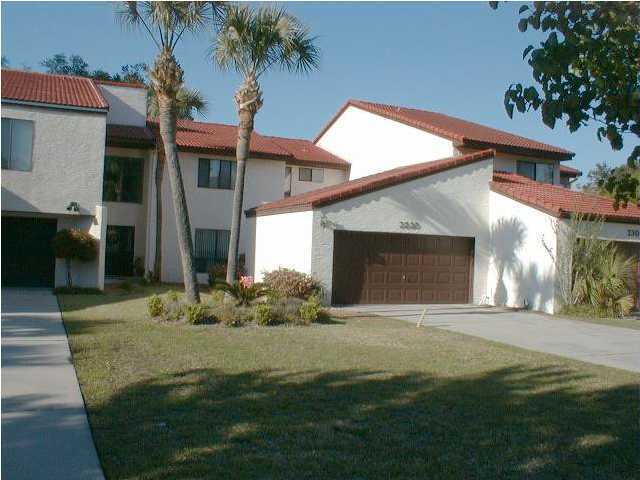 All Ages and sizes including Sq Ft are aprox, Please verify...Beautiful Bayfront townhome at Panama Country Club. Features formal living area, dining room, and den with fireplace and wetbar. Large kitchen, extensive master suite, and inside utility room. Exterior has 2 car garage, deck.  . Wonderful setting on the water