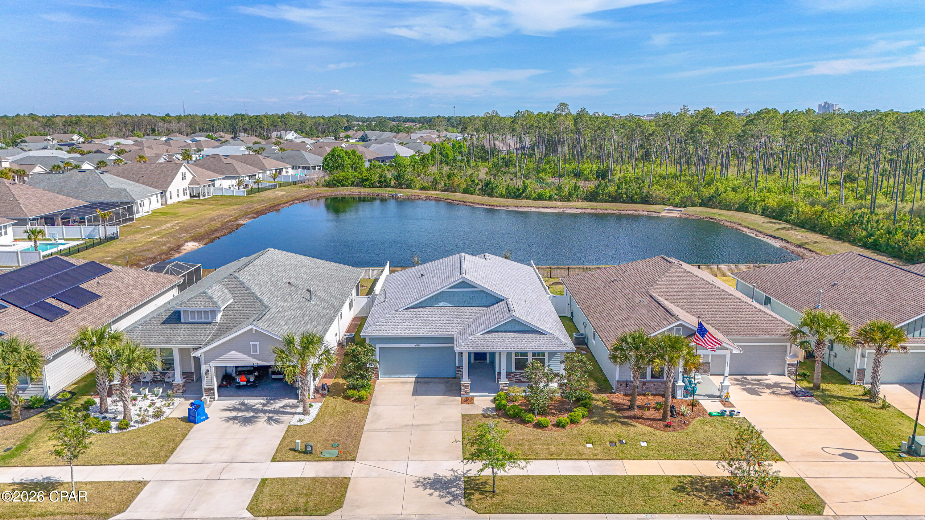 Reduced-  a terrific opportunity for pondside Samuel Taylor home. Experience elevated coastal living in this highly coveted Trigger floor plan built by Samuel Taylor homes, located on THE LAKE. This floor plan is offering 3 bedrooms and 2 bathrooms with designer finishes throughout. Elegant  Luxury Vinyl plank flows seamlessly through the open-concept layout, drawing you into a stunning chef's kitchen that serves as the heart of the home. Thoughtfully appointed with soft-close gray cabinetry, custom pull-outs, pot and pan drawers, under-cabinet lighting, and a striking glass backsplash, this space blends beauty with functionality.

The spa-inspired bathrooms showcase quartz countertops, refined cabinetry, and beautifully detailed tilework. The primary suite is a true retreat, featuring dual vanities, a rain head shower, and a custom walk-in closet designed for both style and organization.

Step outside to a private backyard sanctuary, fully fenced with added pet protection and enhanced by a sleek black iron rear fence that preserves tranquil pond and wooded views--perfect for relaxing or entertaining.

The insulated two-car garage offers added comfort and practicality with attic access and a professionally finished floor. Built with superior craftsmanship, the home includes 2x6 exterior wall construction, enhanced insulation, a hurricane tie-down system, architectural shingles, and Kevlar-style storm protection for peace of mind. HOA covers common area maintenance, twice-weekly trash. Flood zone X.