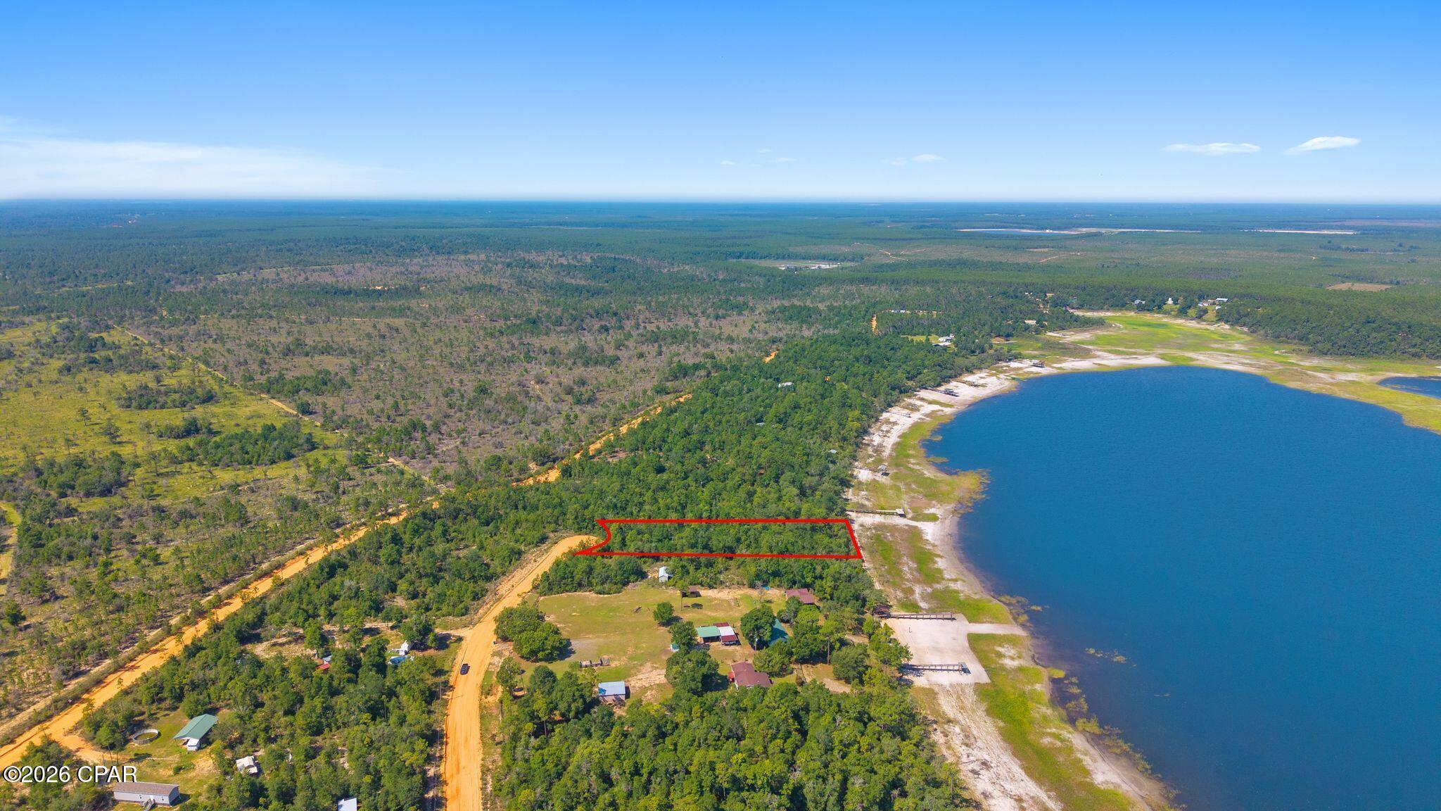 **Experience the best of Florida waterfront living on Porter Pond!** This exceptional lakefront property offers the perfect blend of recreation, relaxation, and natural beauty. Porter Pond is one of the few lakes in the area that allows both motorized boats and jet skis, making it an ideal destination for water lovers.

At almost 1 acre, this lot is situated at the end of Lakeside Drive on a peaceful cul-de-sac, this property is conveniently located directly across the lake from the paved public boat ramp at White Oak Landing.

Whether you're ready to build your dream home, place a mobile home, or create the ultimate weekend retreat with a pole barn, the possibilities are endless. Beyond the lake, adventure awaits...ride your ATV to some of Northwest Florida's most beautiful natural springs. Within minutes, you'll find Williford Spring, Sylvan Spring, and the crystal-clear waters of Econfina Creek, where you can spend your days kayaking, canoeing, swimming, fishing, or simply floating while taking in the scenery.

If you've been searching for a property that offers the perfect combination of waterfront living and outdoor adventure, this is your opportunity to own a slice of paradise.