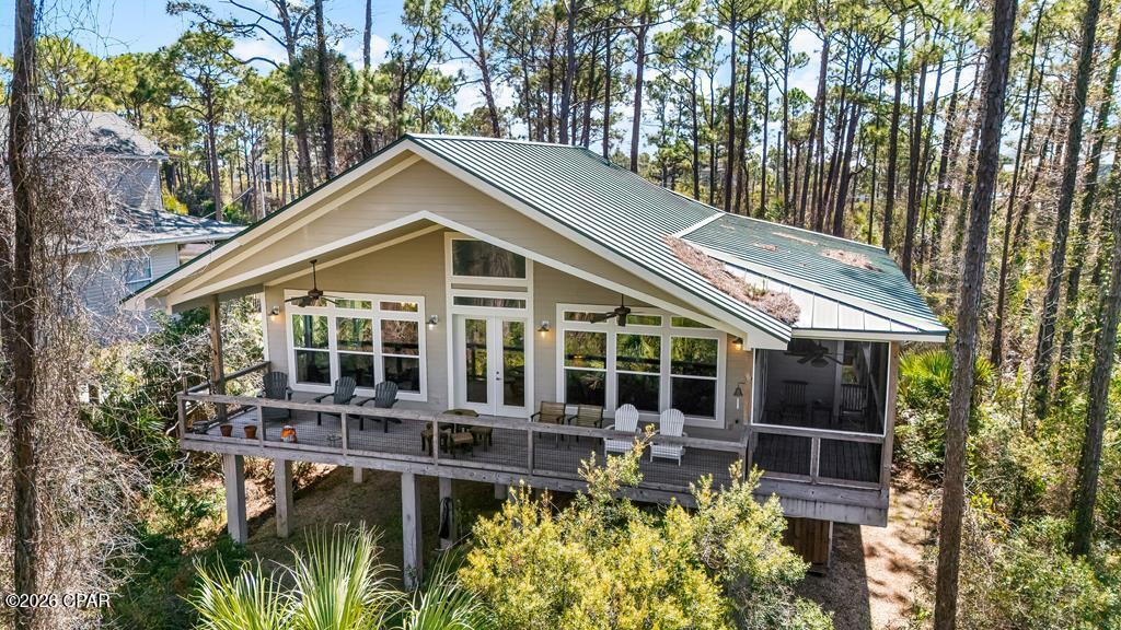 CHARMING BAYFRONT ICF HOME ON SOUTH CAPE SAN BLAS WITH BEACH ACCESS. This 2BR - 2 BA, thoughtfully designed property has never been rented and has been carefully maintained, offering a opportunity for a private coastal retreat or full-time residence. Each bedroom features its own private bathroom, providing comfort and privacy for owners and guests. The home's durable Insulated Concrete Form (ICF) construction delivers exceptional strength, energy efficiency, and resistance to fire, storms, mold, and pests, while also providing superior noise reduction. Spacious open-concept living, dining, and kitchen area creates an inviting central space for the home, providing ample room for gatherings, entertaining, or accommodating larger families while enjoying the relaxed coastal lifestyle. Large panoramic windows frame stunning bay views and fill the home with natural light the home features granite countertops throughout, stainless steel appliances, custom shades and shutters, and custom built-in bookshelves, a desk, and buffet cabinetry that enhance both style and functionality. Outdoor living is just as impressive with a large deck featuring a screened area, perfect for enjoying breezes off the bay. Additional conveniences include an elevator, a storage shed, an outdoor hot-water shower, a security system, a dehumidifier, and a water purifier. Explore the beaches, take leisurely walks along the shoreline, enjoy a day of swimming with beach access conveniently located just across the road on Pebble Beach Way, or ride the bike path right outside the home to Salina's Park for pickleball and other recreational activities. For the water enthusiasts, this area is a haven for fishing, boating, kayaking, and paddle boarding, offering a variety of opportunities to experience the rich marine life. This property combines strong construction, thoughtful design, and a prime bayfront setting, making it an exceptional opportunity on Cape San Blas.