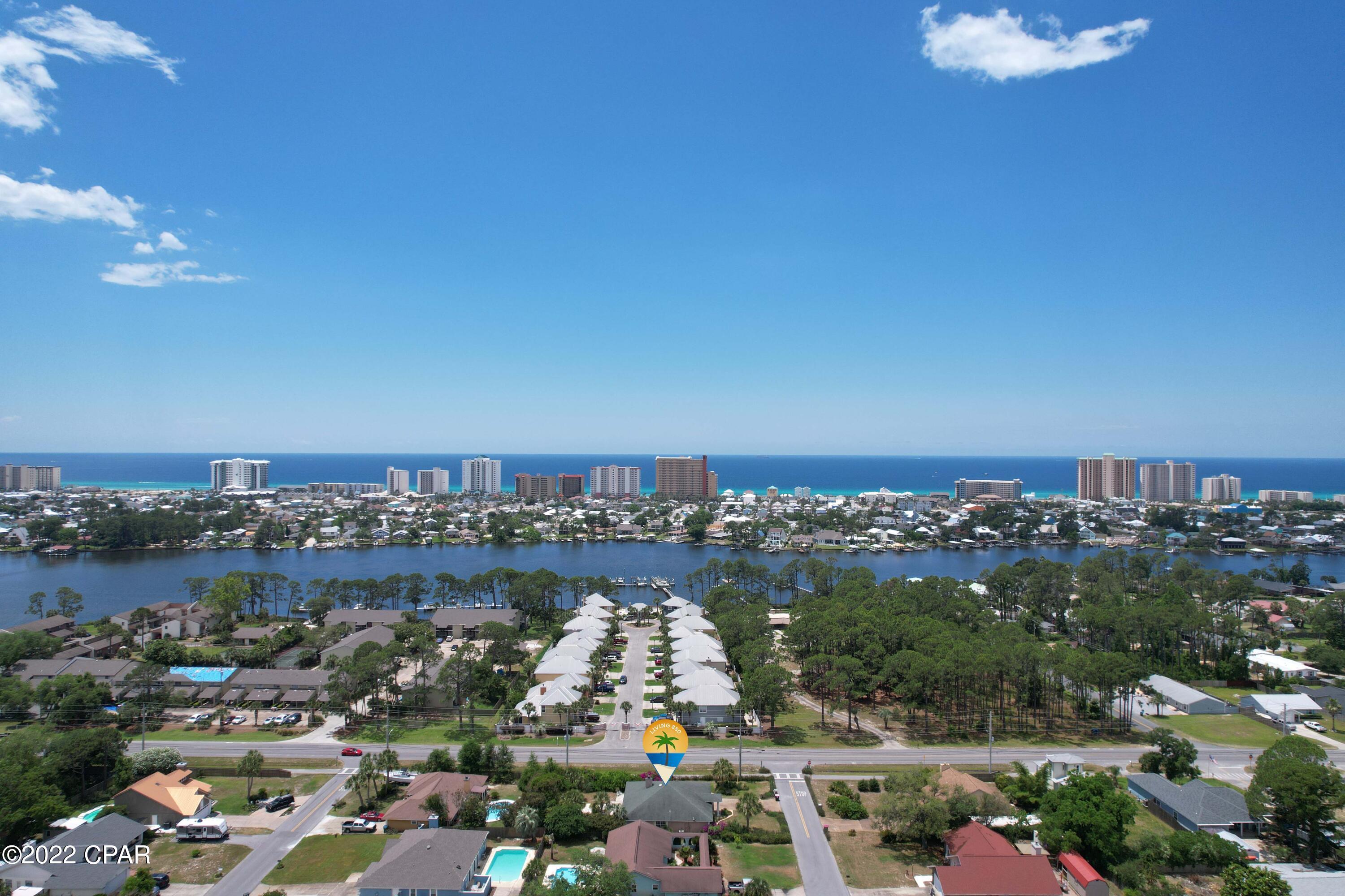 This is truly a golf cart ride to the beach or a quick walk to the Grand Lagoon. When location is a factor, this is 'WOW''! When you have NO HOA fees to pay and NO FLOOD INSURANCE requirements, it means money in the bank! Enjoy the wood burning fireplace and the double garage! The exterior of the home was recently painted, and a new water heater was added in the past few months. There is much to love about the area with great access to many SUPER dining and shopping experiences. The sidewalks on North Lagoon will allow for that daily walk, but the GORGEOUS BEACH close by should be the REAL drawing card!