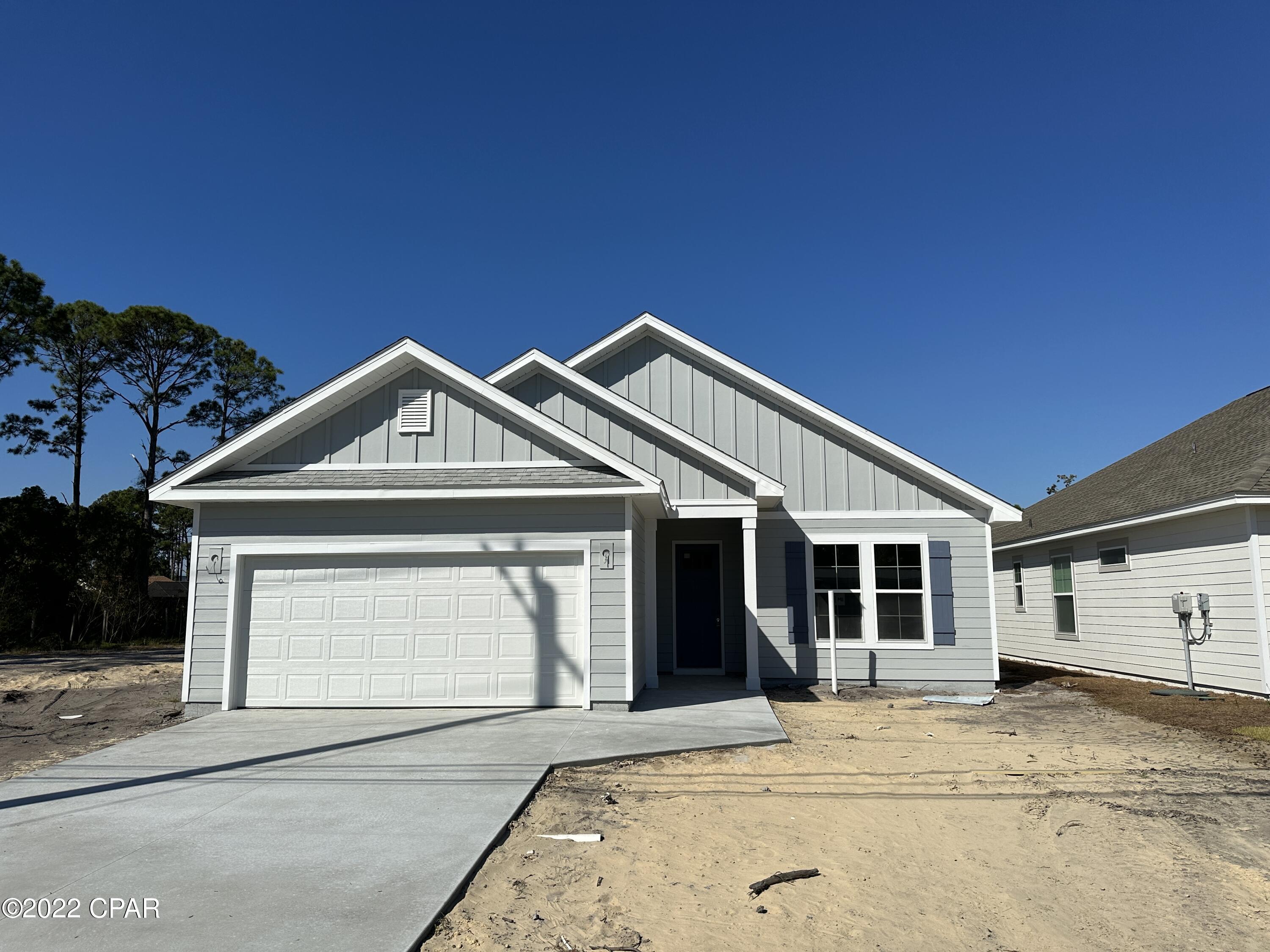 Completion scheduled for late October 2022. Great opportunity to purchase a beautifully constructed brand new home, centrally located in Panama City Beach, with no HOA fees! Located directly next door to several other lots that will soon have new homes from the same Builder as part of the ''Laurie Collection'', this open floor plan home features 9' ceilings, LVT flooring throughout, tiled master shower, double vanity master bath, stainless range/microwave/dishwasher, large kitchen island, large living area, large master bedroom with tray ceiling, very large back yard, and a 2 car garage. The house is on city sewage and water. This home has been constructed with quality materials throughout, including granite counter tops, hardie-board siding, enhanced insulation, 30 year shingles, professional landscaping(including irrigation), and to top it off this house comes with the peace of mind of a Builder's Warranty

All sizes and measurements are approximate, verify if important.
