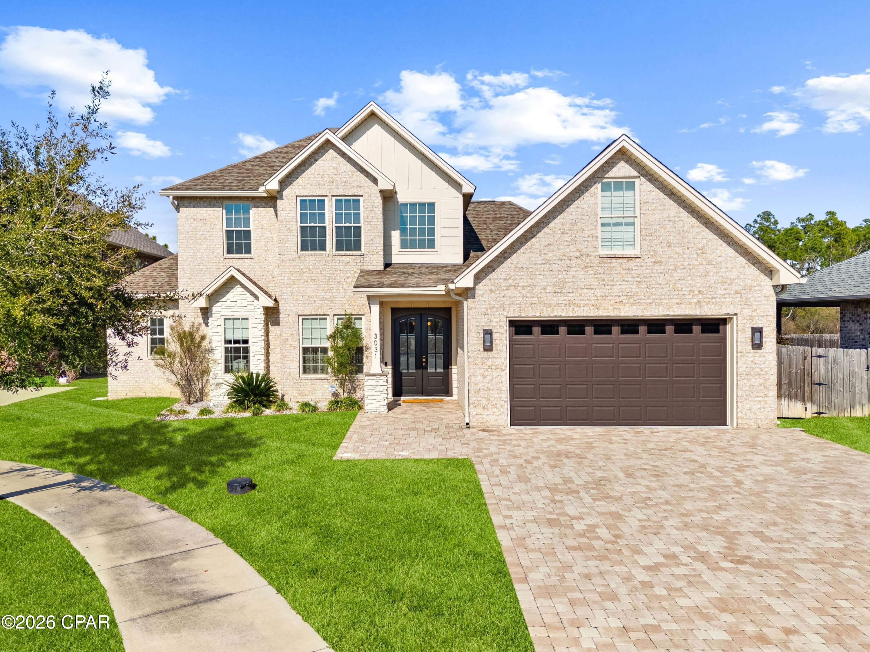 Welcome to 3031 Osprey Circle, an exceptional custom home located in the desirable Osprey Cove community, right in the heart of Lynn Haven. Built in 2020, this thoughtfully designed four-bedroom, four full-and-two-half-bath residence offers 3,439 square feet of beautifully curated living space across two stories, blending modern luxury with everyday comfort. Each bedroom features its own attached bathroom, offering privacy and convenience for family and guests alike.

The main level features a spacious primary suite complete with a built-in sauna and private door leading directly to the backyard, creating a true retreat-like experience, along with an additional first-floor bedroom ideal for guests or a home office. The heart of the home is the custom kitchen, perfectly positioned for entertaining and everyday living, flowing seamlessly into the main living area where a fireplace adds warmth and character. Upstairs, you'll find two additional living rooms, providing flexible spaces for media, play, or relaxation, along with generously sized bedrooms and baths.

Step outside to your private backyard oasis set on 0.37 acres, featuring a resort-style pool and spa, a convenient outdoor half bath located just off the pool, and an outdoor shower for added functionality. Full fencing and lush greenery behind the home provide exceptional privacy with no neighbors to the rear. Additional highlights include a two-car attached garage, modern finishes throughout, and a prime location with easy access to shopping, dining, commercial conveniences, and top-rated schools.

This home delivers space, privacy, and luxury in one of Lynn Haven's most sought-after communities, an opportunity not to be missed.