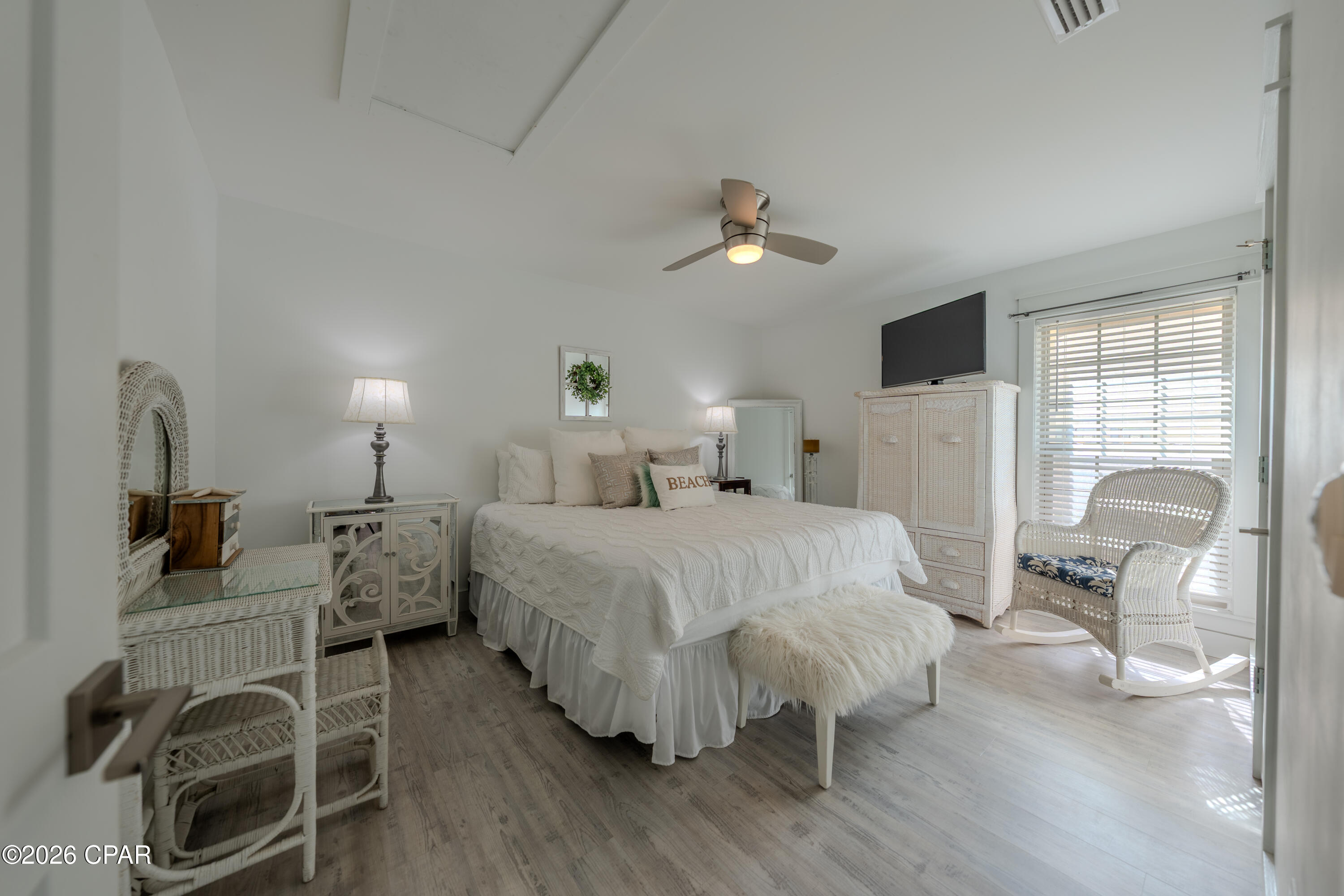 REDUCED to $248,000 and AVAILABLE TO SHOW  now through June 1st!  Welcome to this beautifully renovated, first-floor one-bedroom, one-bath villa in the highly desirable Horizon South beach community. Thoughtfully updated and impeccably maintained, this turnkey residence offers a refined coastal aesthetic and is ideal as a primary home, elegant beach retreat, or high-performing vacation rental. The interior is light and sophisticated, featuring white-washed luxury vinyl plank flooring, quartz countertops in both the kitchen and bath, stainless steel appliances, and a vaulted living and dining area that enhances the open, airy feel. There are no popcorn ceilings, reinforcing the home's clean, modern design. Expansive sliding glass doors open to an enclosed and furnished patio with an outdoor shower, creating a seamless indoor-outdoor coastal lifestyle. An electric fireplace and stackable washer and dryer add both comfort and convenience. Major systems including the roof, HVAC, water heater, windows, and sliding glass doors have all been replaced within the last six years, providing exceptional peace of mind. Residents enjoy a short walk or golf cart ride to the beach in this pet-friendly, golf-cart-friendly community that allows both short-term and long-term rentals. Horizon South is known for offering more amenities than any other beach community, including four pools, mini golf, a hot tub, tennis and pickleball courts, a game room, a community center, and a recently updated fitness center. The only thing left to do is arrive and unwind, as the Gulf of America is just a four-minute walk from your door, offering effortless beach access and a lifestyle designed for relaxation.