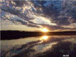 WATERFRONT GETAWAY ONLY 25 MINUTES FROM PANAMA CITY! Get ready to enjoy peace and privacy, great sunset views, and calm waters with the purchase of this impressive 2 bedroom 2 bath modular home. Located in Washington County on the beautiful Hicks Lake, this property has over 100 feet of lake-frontage and is one you have to see in person to truly appreciate. You can fish for largemouth bass in the clean and clear lake, or take your boat out and enjoy a nice day on any of the three lakes in the area (Hicks Lake, Lucas Lake, and Stewart Lake). The lakes are close enough to the property that you can take a short golf cart ride to either of them. This doublewide modular home is in great condition and features a living room, a kitchen with dining area, laundry area, and two large bedrooms in