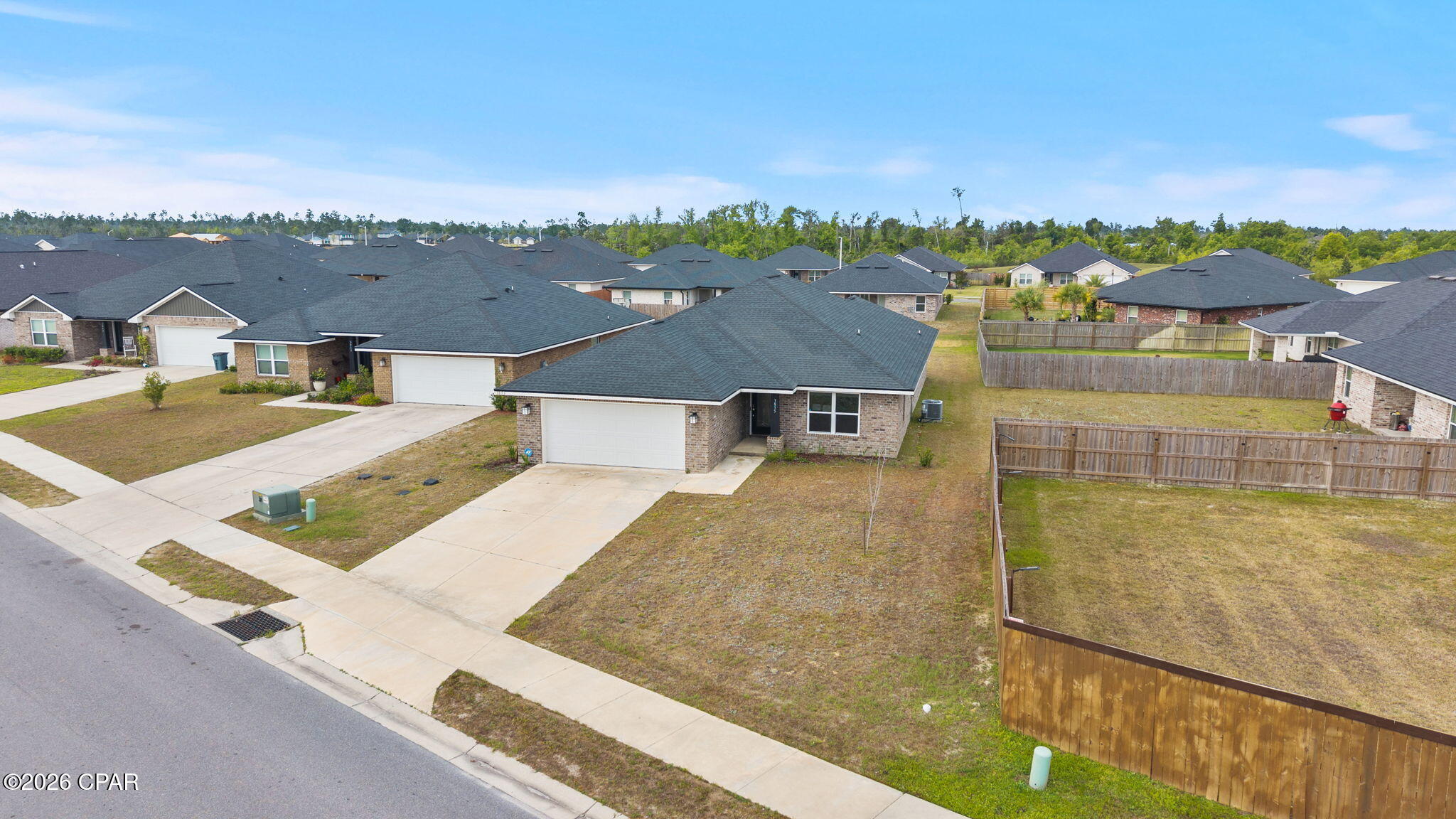 BEST Priced in highly sought-after College Station neighborhood of Panama City! This welcoming open floor plan features three-bedrooms, two-bathrooms offering 1,901 square feet of well-designed living space that checks all the boxes for comfortable Florida living.

The split floor plan gives everyone their own space, which is honestly one of the smartest layouts out there. The primary bedroom is a true retreat, featuring a large closet and a double vanity bathroom that makes morning routines a breeze. Vaulted ceilings throughout create an airy, open feel that makes the home live even larger than its generous square footage suggests. Vinyl plank flooring runs through the home, giving you that beautiful look without the fussy maintenance. The kitchen comes equipped with a pantry, because nobody ever complained about having too much storage.

Ceiling fans keep things comfortable alongside the central electric system, and the garage provides covered parking plus extra room for all your stuff. The quality of construction here is evident in every detail, built to handle the Florida lifestyle with ease.

The neighborhood puts you in a fantastic spot with Publix just minutes away for grocery runs, Zollie Young Dog Park nearby for your pets, and North Bay Haven Charter Academy right around the corner. Residents will also appreciate easy access to Mosley High School and even Florida State University Panama City for higher education options.

This one is fresh on the market and ready for its new owners. Schedule your showing today before someone else calls it home! Washer, Dryer, and TV in primary bedroom convey in as-is condition with the sale of this home.