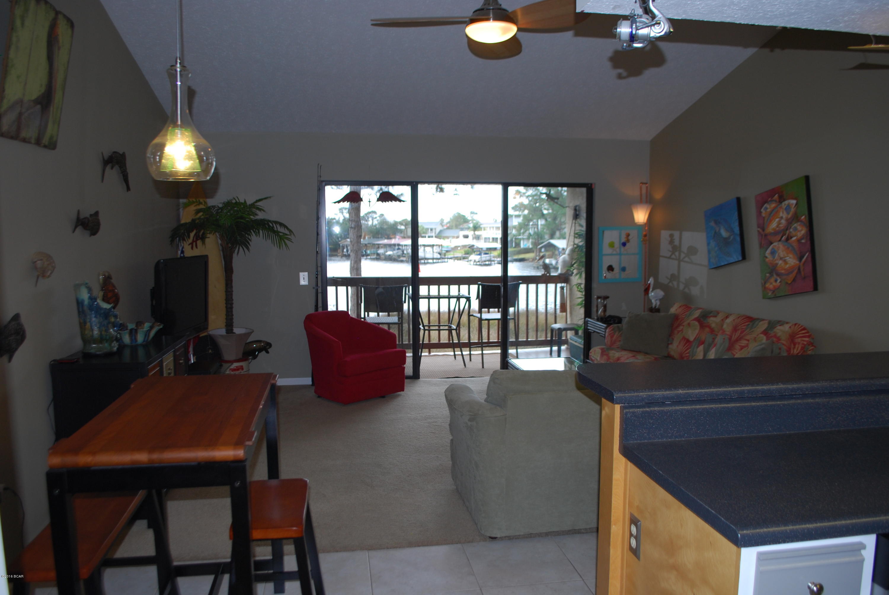 Cute, well kept one bedroom unit overlooking Grand Lagoon. Condo features an open living area with vaulted ceiling and sliding glass doors with nice views. Beautiful half bath in hallway and Washer/Dryer closet in unit. Bonus closet space in the hallway and extra storage on balcony. New HVAC system in 2012, new appliances and updated kitchen and bath. Point Lagoon Condominiums offers an in-ground pool, boat storage available, community dock and pavilion on the lagoon.