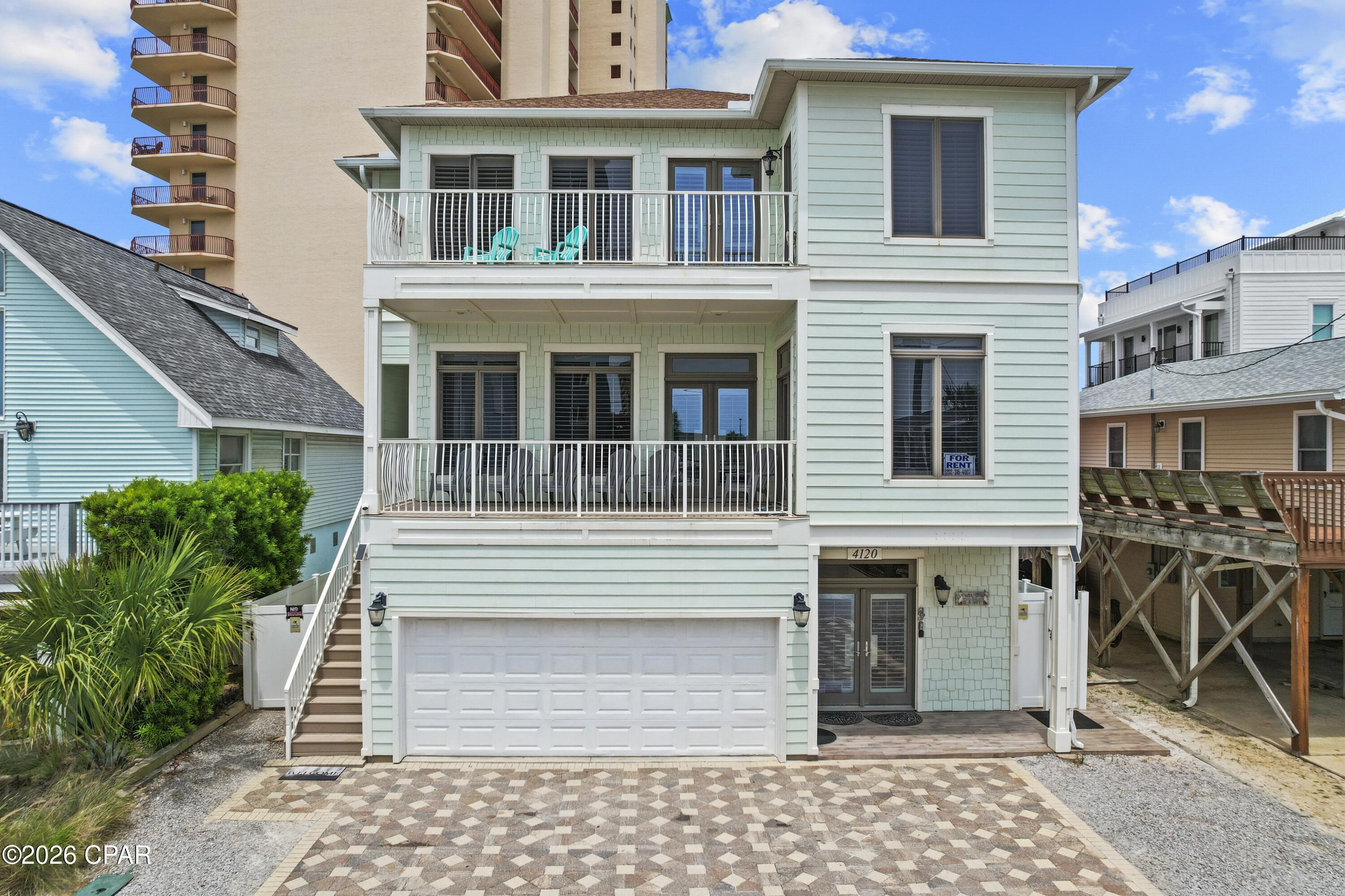 EXCEPTIONAL VALUE ALERT - PRICE IMPROVEMENT OF $150,000! Repriced for immediate sale, this elegant Mediterranean-style beach home presents an outstanding opportunity on the Emerald Coast. Located just 75 feet from the sugar white sand with Gulf views from multiple balconies, this spacious 3-story property is being offered FULLY FURNISHED and TURNKEY with  $215,000 in 2025  rental income and future bookings transferable to the new owner.

Featuring 7 bedrooms, 4 full baths, and approximately 3,451 square feet, this thoughtfully designed home offers flexibility for personal use, large groups, or vacation rental investment potential. Interior features include soaring 10-foot ceilings, custom cabinetry, granite countertops, stainless steel appliances, commercial-grade tile flooring, and abundant natural light throughout.

Designed with functionality in mind, the property includes TWO full kitchens, TWO laundry areas, and a lockout configuration ideal for maximizing occupancy and rental versatility. Spacious indoor and outdoor living areas provide ample room for entertaining and relaxing after a day at the beach.
Outdoor highlights include a PRIVATE HEATED POOL, expansive balconies with Gulf views, covered patio spaces, and ample parking with a 2-car garage plus 5 additional driveway parking spaces. Low annual HOA dues add to the appeal of this exceptional coastal property.

Whether you're searching for a primary residence, second home, or income-producing beach investment, this turnkey property offers space, location, and exceptional value in the heart of Panama City Beach.
