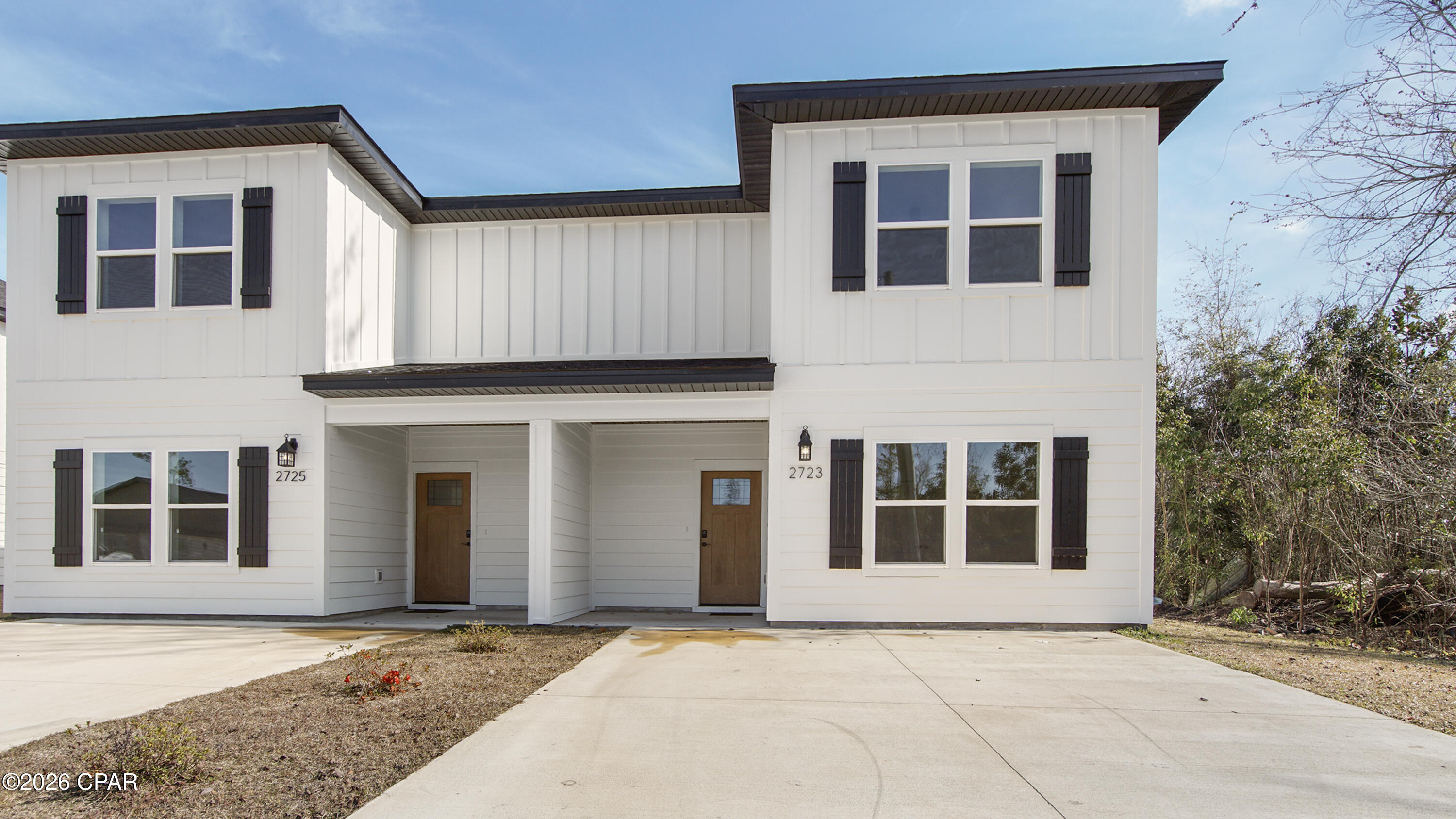 Discover modern luxury living in this newly constructed home near Highway 231 in Panama City, Florida—an ideal primary residence, second home, or investment property with short-term rentals allowed and no HOA. Conveniently located near shopping, dining, and just 18 minutes from Tyndall Air Force Base, this open-concept home offers a flexible floor plan with a main-level bedroom ideal for a guest suite or home office, a full bathroom, and ample storage. The stylish kitchen features white shaker cabinetry, soft-close drawers, quartz countertops, stainless steel appliances, a large center island, and a spacious walk-in pantry, complemented by sleek black hardware. Luxury vinyl plank flooring flows throughout the home for durability and low-maintenance living. Upstairs, a split floor plan provides privacy with an expansive primary suite measuring 13'7'' x 15'8'', complete with a walk-in closet and en-suite bath featuring double vanities and quartz countertops, along with two additional spacious bedrooms, a full bathroom, and a convenient upstairs laundry room. Enjoy outdoor living on the covered back porch and added peace of mind with a one-year builder warranty, a ten-year structural warranty, Hardie board siding, a fully sodded yard, and a Rheem tankless water heater—making this exceptional new construction townhome truly move-in ready.