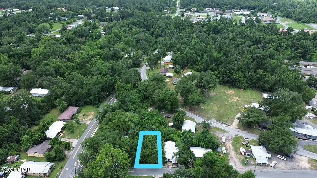 Discover this peaceful wooded vacant lot in the heart of Marianna, Florida. Spanning 0.10 acres, this private parcel offers a serene, tree-covered setting perfect for constructing your custom home, a cozy cabin, or as a solid land investment in a convenient city location.

The lot provides a blank canvas in an established neighborhood, giving you the privacy and space to create exactly what you envision while enjoying all the benefits of city living.

Marianna is a full-service city with everything you need right at your fingertips, including shopping, restaurants, grocery stores, pharmacy, lumber and hardware stores, and a hospital. It is also home to Chipola State College, adding a vibrant educational atmosphere to the community.

Outdoor enthusiasts will love the proximity to Florida Caverns State Park, where you can enjoy camping, hiking, swimming, fishing, and guided tours of the stunning limestone caves.

Strategically located, Marianna is just 40 minutes from Dothan, AL and a little over an hour from the beautiful beaches of Panama City Beach.

This is the perfect opportunity for first-time builders, retirees, or investors seeking affordable land in a growing area with strong amenities and natural attractions. Country charm meets city convenience in Marianna.

Don't miss out on this rare chance to own a piece of Marianna. Schedule a viewing today and start planning your future here.