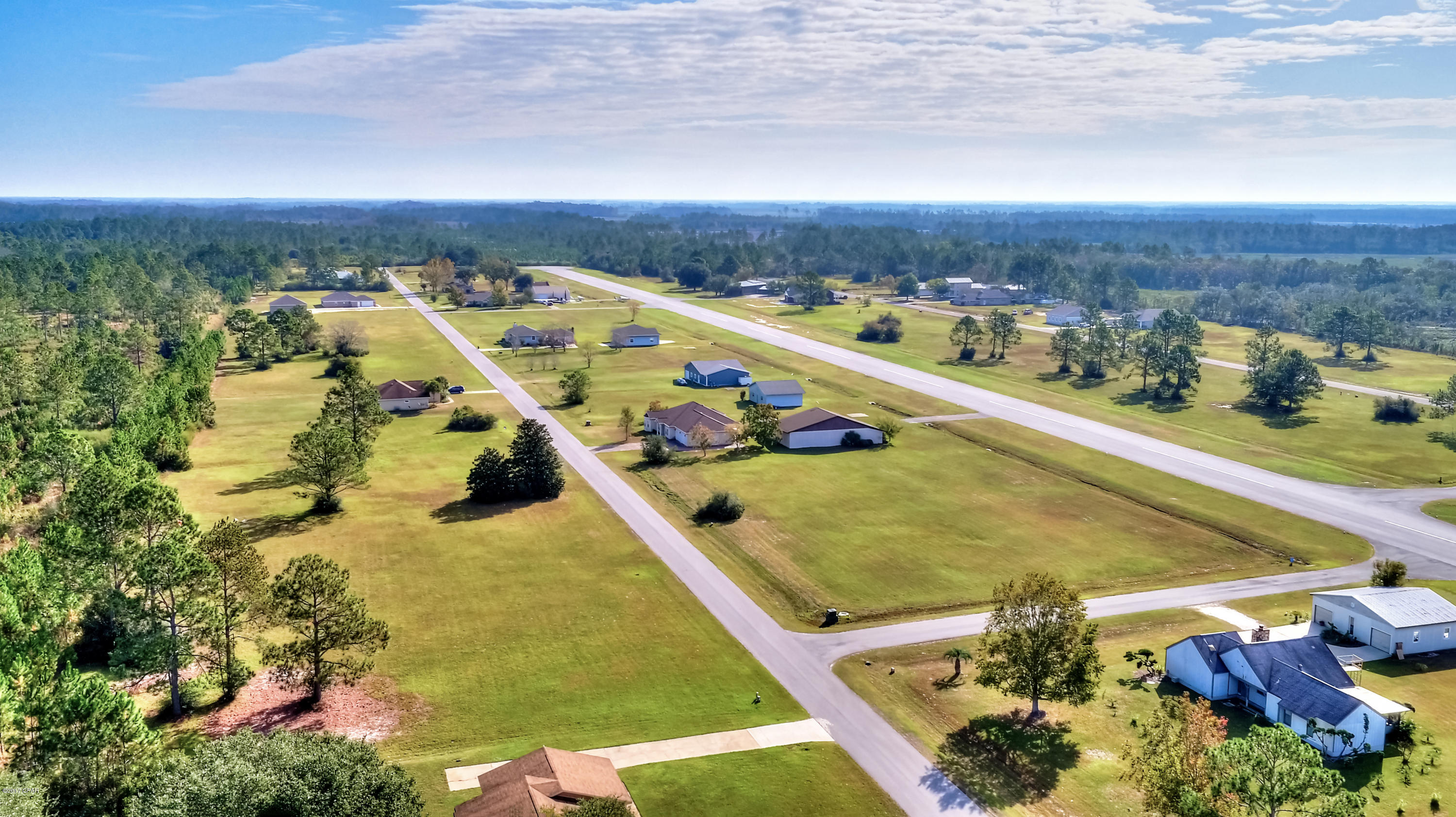 This is a light aircraft pilot's dream location for a primary home or secondary residence! Skip the traffic. Skip the snow. Fly into Panama City, Florida and step out of your plane and onto your front yard! This 0.75 acre lot is cleared and ready to build on. Lot 44 is RIGHT ON THE RUNWAY and VERY close to the subdivision entrance and the Club House. ALL assessment fees current and PAID - Runway, HOA, etc. Underground utilities available. Lot 44 is cleared and ready to build your dream home and hanger right on the north side of the runway.



The paved runway is 3200 feet with lights and beacon for night time flying. The FAA airport designator is 75FL located on the New Orleans sectional chart. 



150x216 Lot dimensions approximate. If important, buyer to verify.