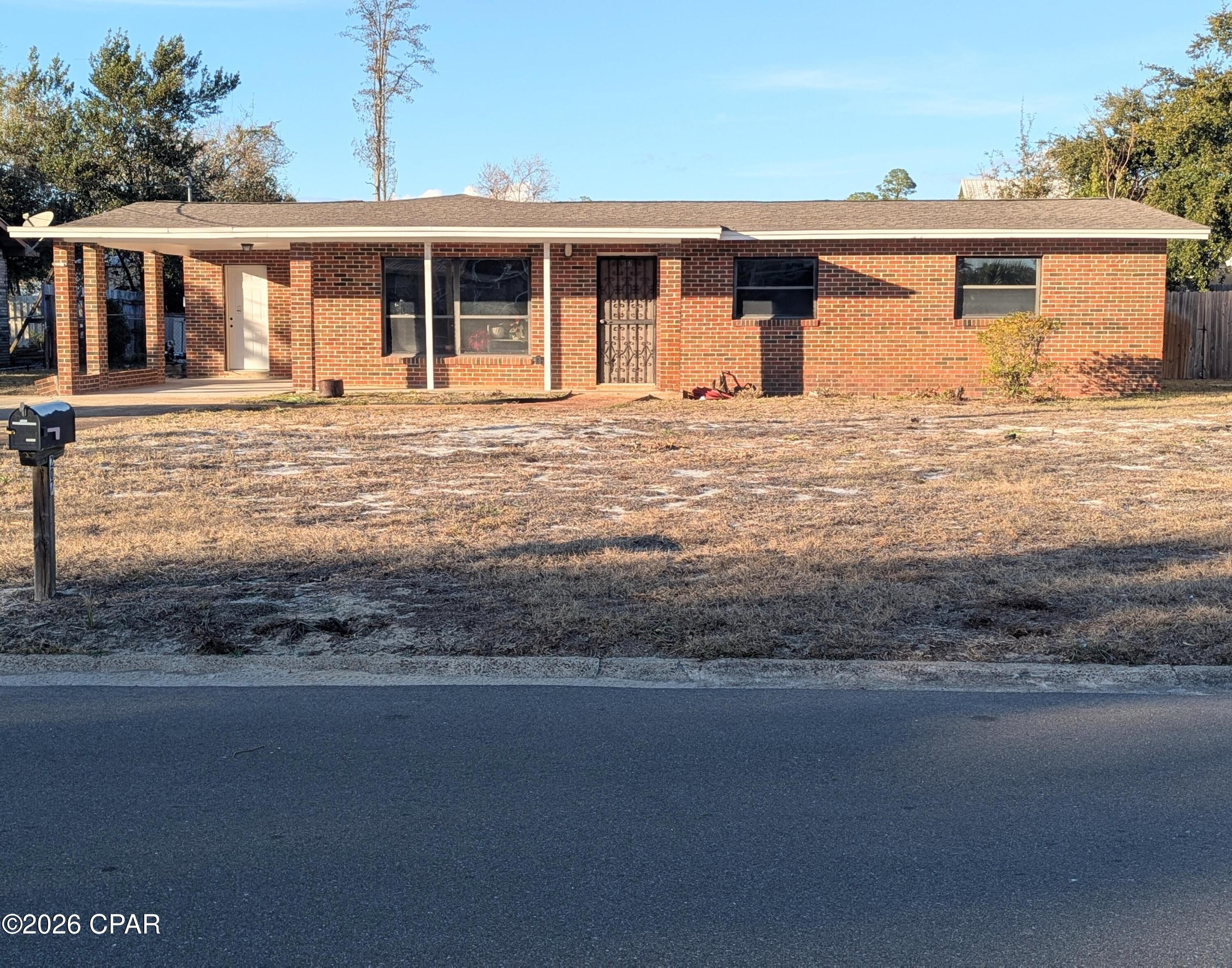 Looking for a spacious home with great bones, HVAC replaced in 2024 to include duct work, updated electrical to 2025 code and roof replaced in 2019? Great opportunity to own in Woodlawn. Owners have out of state opportunity. Our loss is your gain. Great opportunity to own minutes to the world's most beautiful beaches for investors, those willing to put in some elbow grease or for someone with a rehab loan. Huge additional room that can be used for a fourth bedroom. Neighborhood allows for STR's. Golf cart friendly neighborhood. Public bay access for kayaks, paddle boards or relaxing just a few minutes walk down the street. Spacious fenced back yard with two storage sheds.