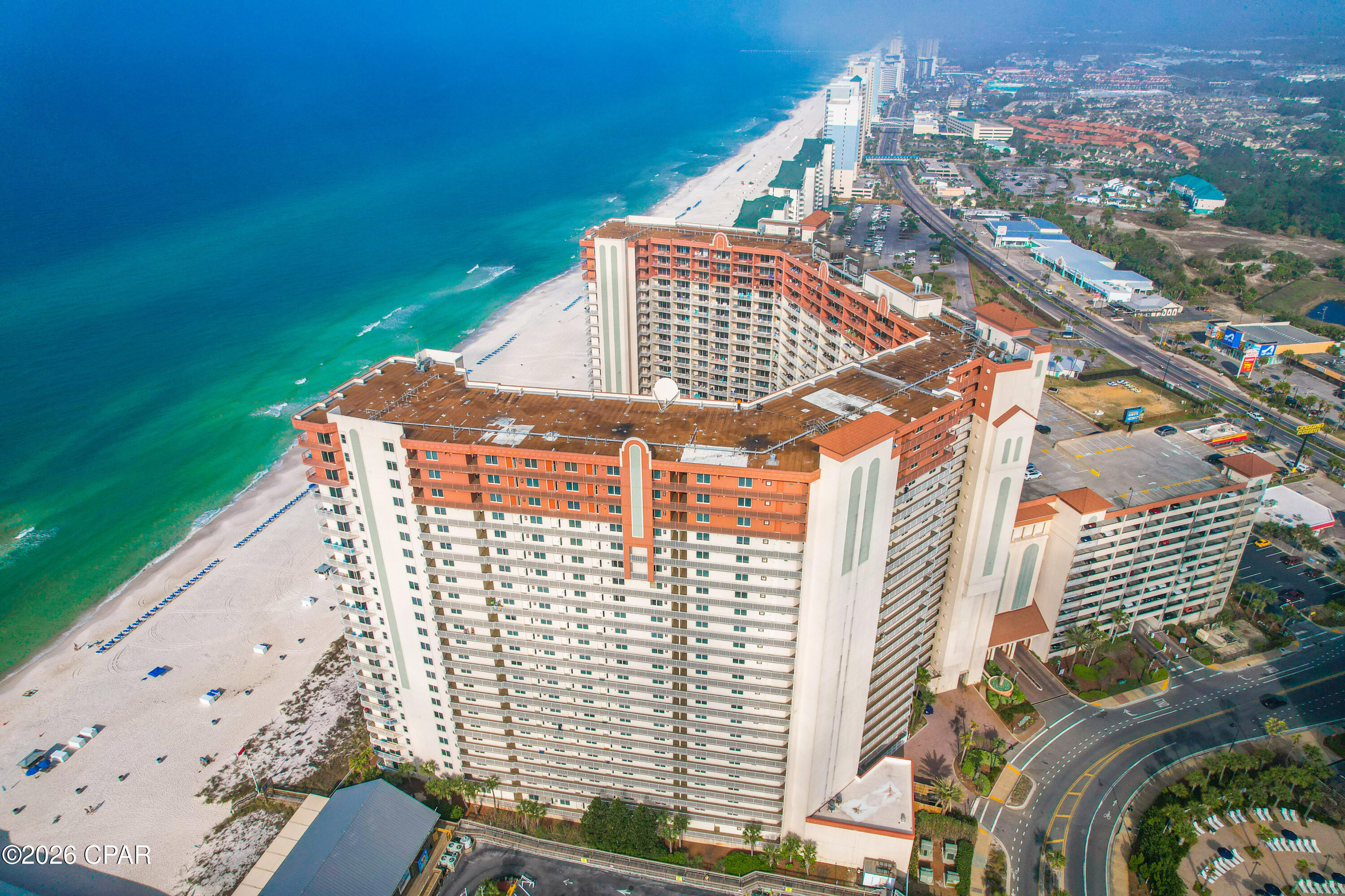 Welcome to Shores of Panama Unit 2208, a beautifully renovated 1-bedroom + bunk area, 2 full bath condo offering the perfect combination of coastal living, comfort, and investment potential. Renovated within the past 12 months, this turnkey condo features all-new flooring, paint, furnishings, appliances, décor, and more. Best of all, this unit has never been used as a vacation rental, making it exceptionally well-maintained and truly move-in or rental ready. Designed to comfortably accommodate 6 guests, this floor plan includes a spacious primary suite, hallway bunk area, and two full bathrooms. Rental projections exceed $40,000 annually, with many comparable units in the resort generating even higher income. Shores of Panama is widely recognized as one of Panama City Beach's premier short-term rental resorts and offers some of the highest ROI potential on the beach, making this an exceptional opportunity for investors or those looking for a second home that can help offset ownership costs. Owners and guests enjoy an impressive lineup of resort-style amenities, including one of the area's largest lagoon-style Gulf-front pools, multiple hot tubs, an indoor heated pool, a 24-hour fitness center, on-site tiki bar and grill, seasonal live entertainment, covered parking, and 24-hour security. Perfectly located, you'll be just steps from Pineapple Willy's and directly across the street from Laketown Wharf, offering a variety of restaurants, shopping, and entertainment. Whether you're searching for a high-performing vacation rental, a second home, or your own beachfront getaway, this fully furnished, turnkey condo checks every box. Sellers are motivated and will entertain all reasonable offers.