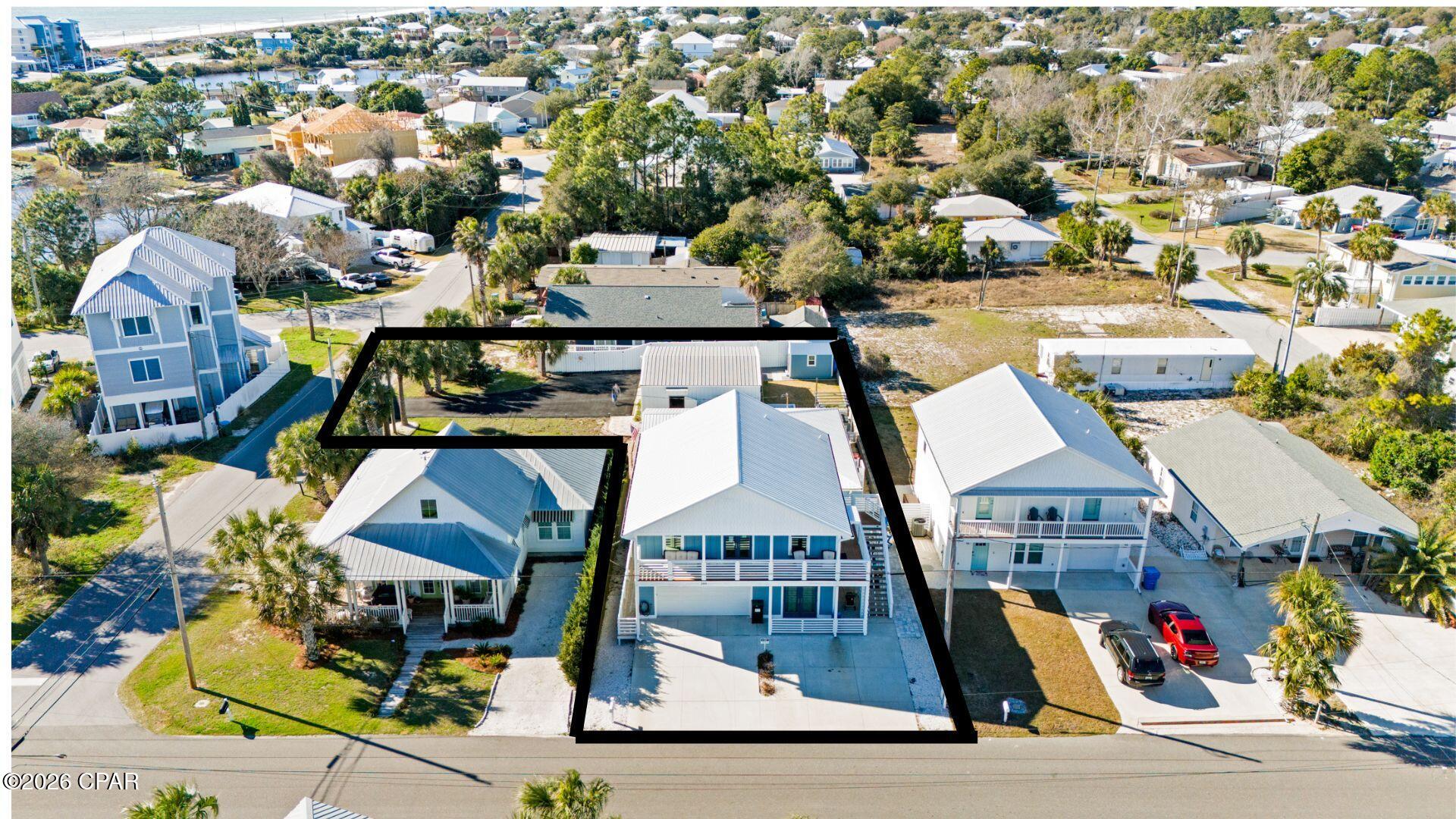 OPPORTUNITY ABOUNDS ON THIS LAGUNA BEACH PROPERTY!

Welcome to 209 Oleander Drive, ideally located in the heart of Panama City Beach on a spacious L-shaped lot, just steps from the sugar-white sands and emerald waters of the Gulf (less than 600 steps to the beach!). This versatile property is perfect as a primary residence, second home, or income producing Long or short-term rental with two separate living spaces.

The main house, currently owner-occupied and remodeled in 2017, features bright living spaces and a functional, open flow that is welcoming for both owners and guests. Step outside to enjoy a private outdoor area perfect for relaxing after a day at the beach or entertaining visitors.

A standout feature is the 30x30 insulated workshop, offering endless possibilities. With plumbing already in place, it could easily be converted into an additional rental unit, used for a home business, or serve as storage for vehicles or a collection.

The property also includes a carriage house (ADU) built in 2023, complete with a two-car garage. Over the past two years, this unit has generated $20,000 annually in short-term rental income, making it an excellent opportunity for buyers seeking immediate investment potential. The two-car garage with separate entrance also offers the option to be converted into additional rental space.

Both homes include a full appliance package, tankless water heaters, walk-in showers, and smoke detectors. The property is connected to city water and sewer (no septic), with one shared water/sewer bill and two separate electric meters. Refer to upgrade list in document section.

Whether you're looking for a personal beach retreat, a long term or short term income-producing property, or a combination of both, this unique opportunity offers flexibility, expansion potential, ample storage, and an unbeatable location.

Schedule your showing today and discover the possibilities of beach living and investment in Panama City Beach!