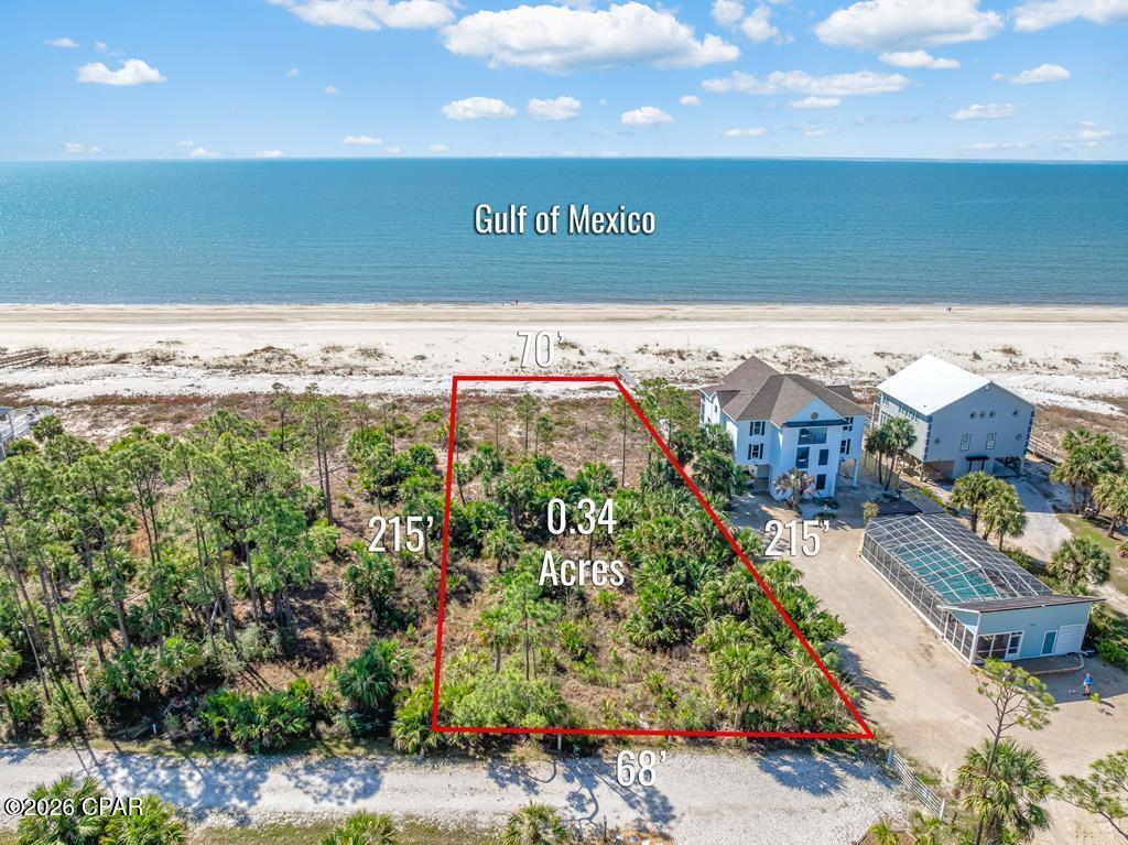 Rare opportunity to acquire the only Gulf front lot in the Indian Summer neighborhood with FEMA federal flood insurance available. This generous 68' wide beachfront lot is in a quiet and buffered location away from any traffic in the peaceful and secluded Old Florida Indian Summer community. The HOA offers a Gulf front community pool and clubhouse with community septic system already in place with recorded CC&Rs to protect your investment. The Old Florida vibe is real, with oyster-shell roads, plenty of palms, pines and foliage preserving the natural surroundings. The beaches here are wide and unspoiled, and you can walk to the Indian Pass Raw Bar with the Indian Pass public boat ramp a short drive down Indian Pass Road. This is a great location with an easy drive in opposite directions to the nearby charming coastal towns of Apalachicola or Port St. Joe.