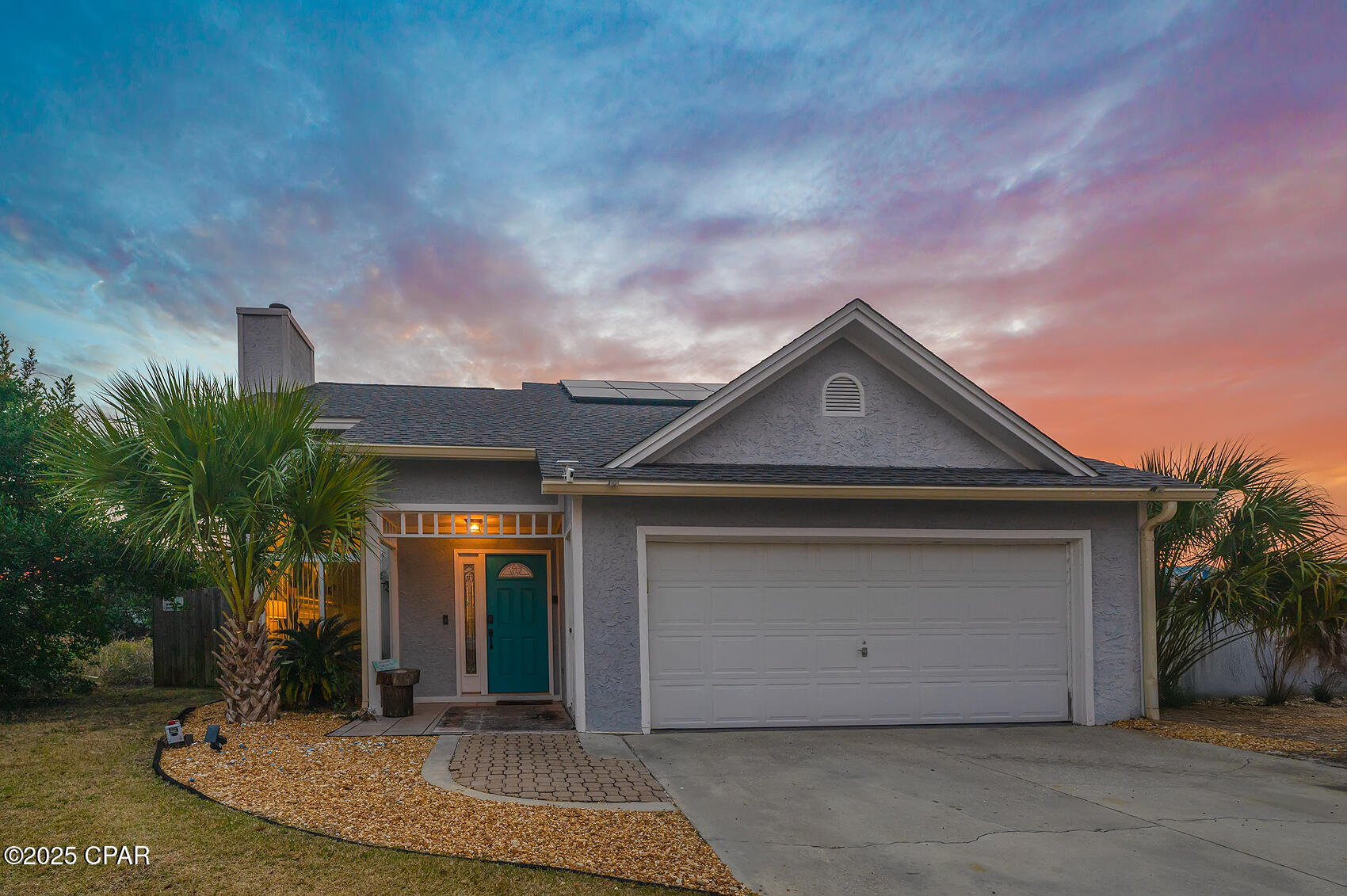 This beautifully updated beach home is the perfect getaway or investment property, located just a short distance from the sugar sand beaches, dining, and entertainment. Bright, open living room with soaring ceilings and a cozy fireplace. The recently remodeled kitchen features stainless steel appliances, butcher block, perfect for cooking and entertaining.

The main floor offers laminate flooring, a spacious master suite, and a second full bathroom. Upstairs you'll find durable vinyl plank flooring, a full-sized bedroom, and a versatile open loft - ideal as a home office, reading nook, or bunk space for extra guests.

Additional features include:

* 2-car garage with poly-treated flooring
* Large, level fenced backyard - perfect for kids and pets
* Sprinkler system
* Fresh exterior paint (2021)
* Termite bond
* AC mini split
* Newer paid-off **solar panels** for low energy bills
* Just 3 blocks to the public boat launch on Dolphin Drive
* Easy golf cart ride to **Schooners** and **St. Andrews State Park**
Short term rental approved!
Everything you need for a relaxing beach lifestyle or a top-performing rental is right here!