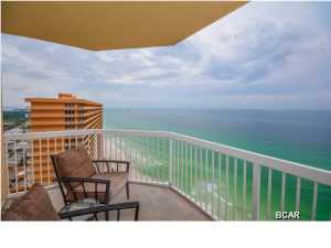 EAST END TOP FLOOR PENTHOUSE CONDO AT SEYCHELLES!! Seychelles is located on the East end of Panama City Beach just minute to St. Andrews State Park and Grand Lagoon. It's tucked off of Thomas Dr. right next door to the well-known Schooner's. This fully furnished 3 bedroom, 2bath condo offers 1,425 sq ft of comfortable living area and endless views from the wall of windows in the living room. Not only do you enjoy amazing Gulf and coastline views, you also capture magnificent Grand Lagoon views from the wrap around balcony and guest bedroom. The spacious kitchen offers a tiled backsplash, stainless steel appliances, excluding the cooktop stove, and a large breakfast bar. The water heater  replaced in 2014; AC replaced in 2012.