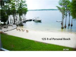 THIS ONE HAS IT ALL !! Great Location, Beautiful View, Private 125' Beach on Beautiful Compass Lake, the premier freshwater lake in North Florida for recreational purposes. Yes, this is technically a mobile home, but doesn't look or feel like one after the extensive renovation work. Comfortable for Family, and set up for entertaining. Wide open Living Area ( Kitchen, Family, Dining ) taking advantage of the water view all across the back of the house. Gas Fireplace with stone front in the Family Room. Screened Room just off Kitchen for outdoor relaxing and entertaining, plus a big open deck area leading down to the Dock. 3 Bedrooms and 2 Baths plus a Game Room that could be converted to Bedroom 4 if desired, and the Master Bedroom has a Sitting Area that could be used for Nursery