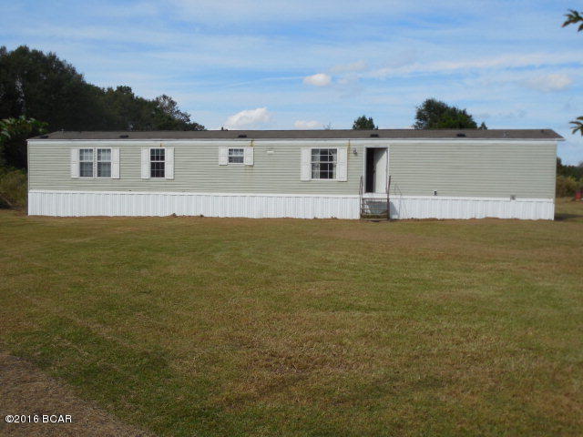 Country Living!! SWMH in Chipley with 4 bedrooms 2 baths with 1064 sq ft on 1 acre! Hardwood floors, carpeting large open kitchen area! Home to be sold in the AS-IS condition. Please call for more information!
