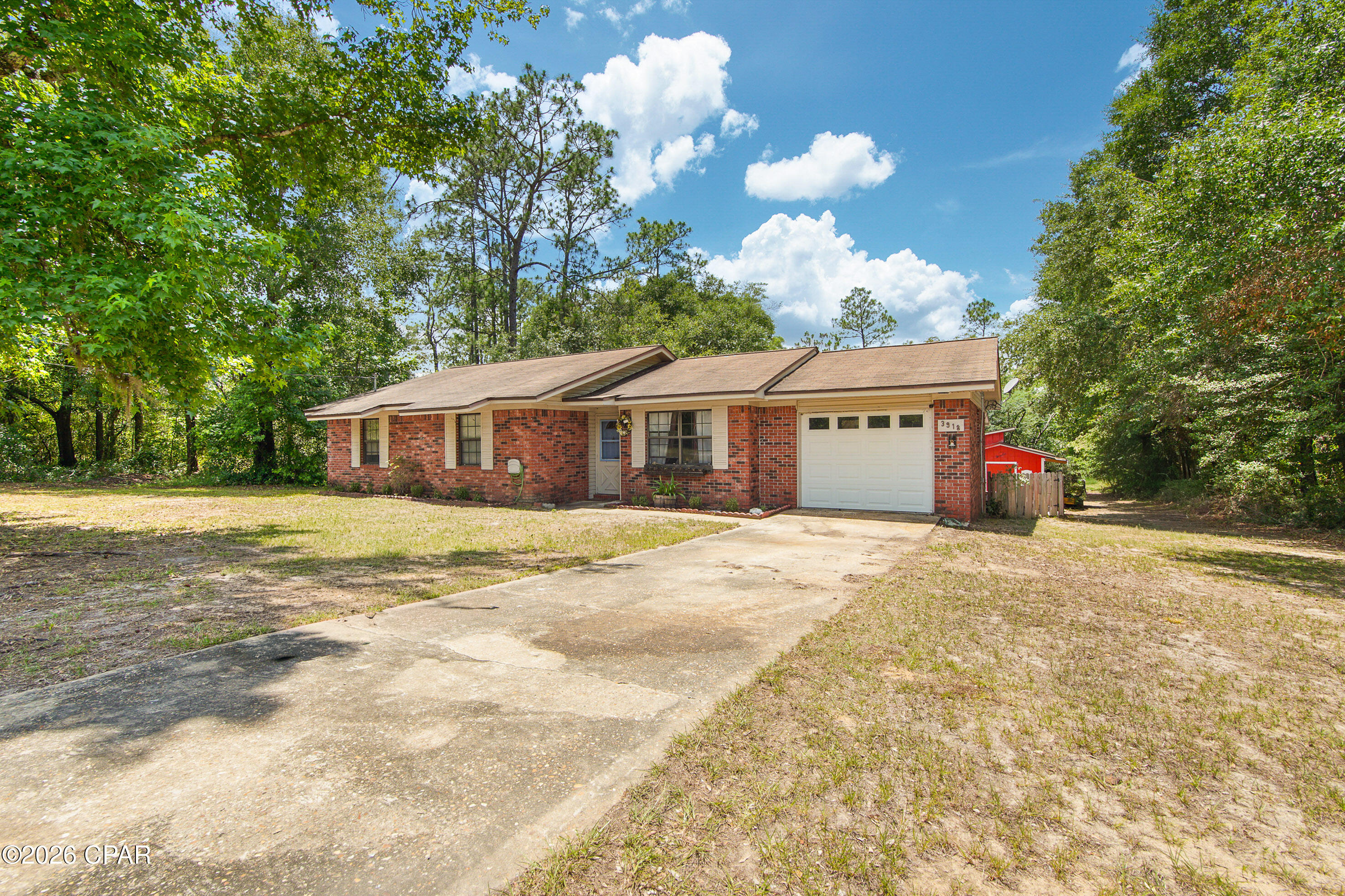This 3 bedroom, 2 bathroom brick home offers a comfortable layout with plenty of space to make your own. The home features a welcoming living area, generously sized bedrooms, master bedroom includes a private bath along with a walk-in closet and a bright Florida-room that provides additional space perfect for relaxing, entertaining, a home office, or a playroom. On the opposite side of the Florida-room, you'll find an attached screened porch, offering a great spot to enjoy the outdoors year-round. The backyard has an outbuilding with electricity. 

Located in Sunny Hills Community, enjoy access to a popular 18-hole golf course, Holmes Creek, Choctawhatchee River and nearby lakes. Situated approximately 45 minutes to our beautiful Gulf and 30 minutes to I-10.