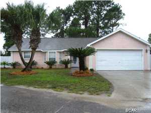 This adorable home is located on a quiet cul-de-sac close to all the schools and attractions of Panama City Beach. The great room and kitchen have beautiful yet durable laminate hardwood flooring and the baths are both tiled. The home features a split bedroom floor plan and nice stainless appliances. The back yard is fenced and has a sprinkler system. A must see if you want to live on the beach! There is a 5 year $45 per month fee. There are approximately 2 years left.