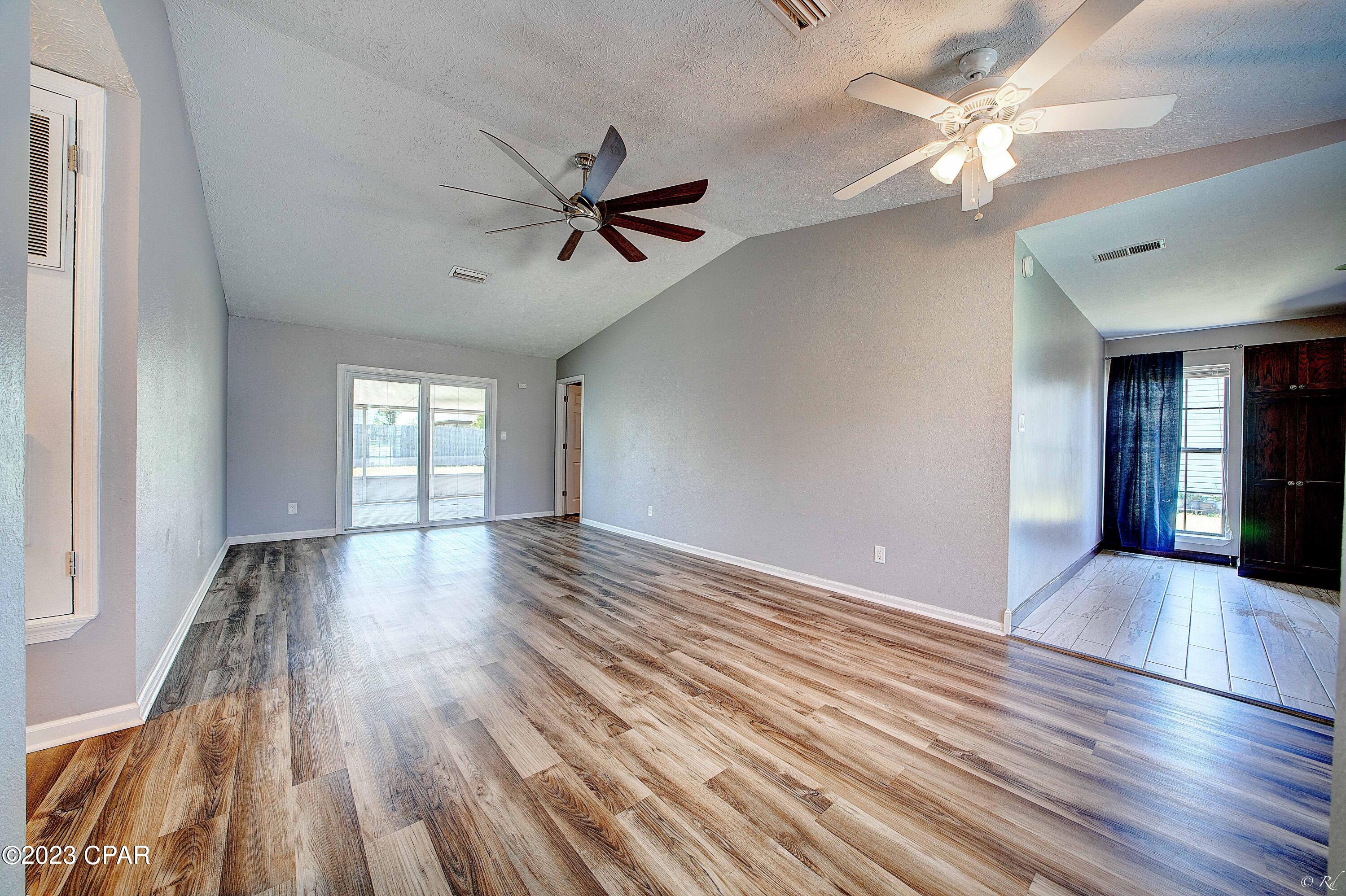 This 1,400+ sq. ft. of living space is a HUGE BARGAIN - JUST LISTED 7/6!!! The garage was converted into a spacious kitchen and laundry room. Plenty of storage space in the shed in the sizable and private back yard. Master bath has a jetted tub and walk-in closet; fresh paint and new luxury vinyl plank throughout. Enjoy the outdoors in the large backyard with a screened in patio.  15 minute drive to Tyndall AFB, 30 minutes to the most beautiful Emerald Coast and white sandy beaches! Call your Favorite Realtor to see this one today! Buyer to confirm measurements and information.