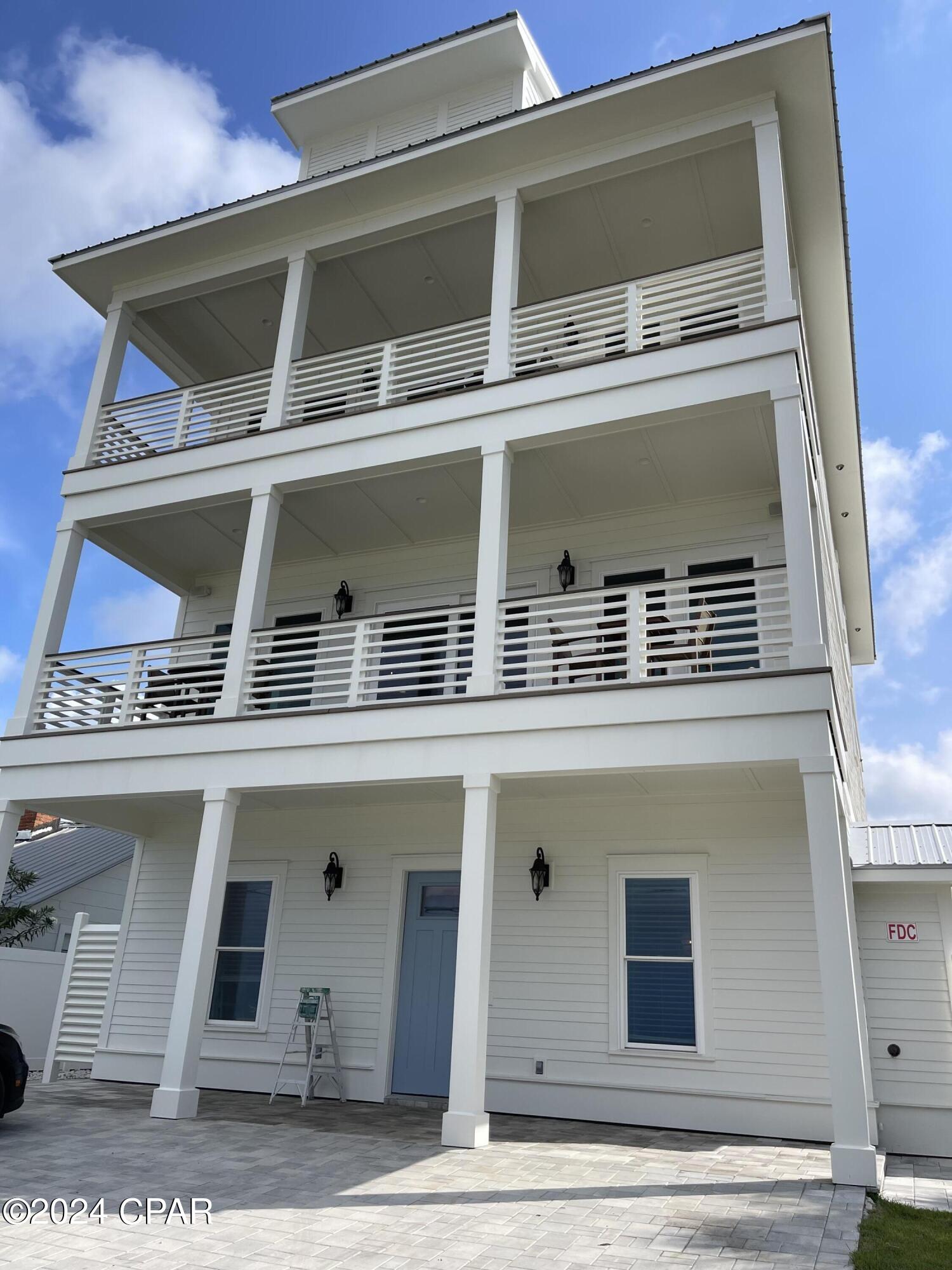 Brand New! Just Finished just in time for the summer. Easy show all weekend.  Open house on 5/25 and 5/26   Experience Unparalleled luxury, This Brand New exquisite 7-bedroom, 7-full bathroom (+2 half baths) vacation rental or primary residence is now ready to go.   Nestled on the tranquil West End of Panama City Beach, this Beach Retreat offers seamless access to the World's Most Beautiful Beaches with a dedicated Private Community Beach access just footsteps away. This Retreat on the exclusive West End has accommodations for up to 18 guests but that's not all, the house has an outdoor entertainment area that is just one-of-a-kind with an Outdoor Kitchen with built in Grill, Refrigerator, Ice Maker, and Bar.  The Pavilion area has a fireplace and outdoor T.V. along with Sound System as well as an oversize Pool, large decks for plenty of outdoor games and a Putting Green on an oversize 50 x 247 lot that will be roomy enough for Weddings, Corporate events or family reunions. The house is a fully furnished Beach House that is truly rental ready. Income models are available, and the property is already on rental program.