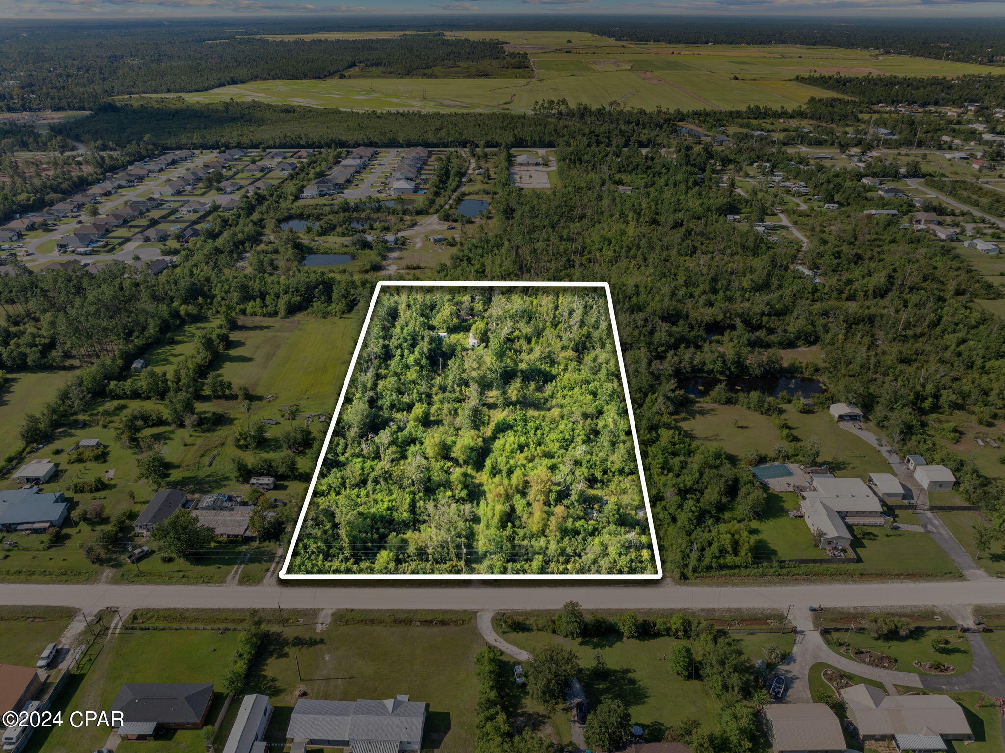Discover the perfect canvas for your dream home on this stunning 4.6 acre wooded lot. Nestled in a serene and private setting, this expansive parcel offers endless possibilities for those seeking a tranquil retreat. The back of the property has a pond with an island. This lot is perfect for a buyer wanting a peaceful country setting while having the convenience of shops and restaurants near by. Personal items on the property will be removed prior to closing. If important, please verify all sizes and information.