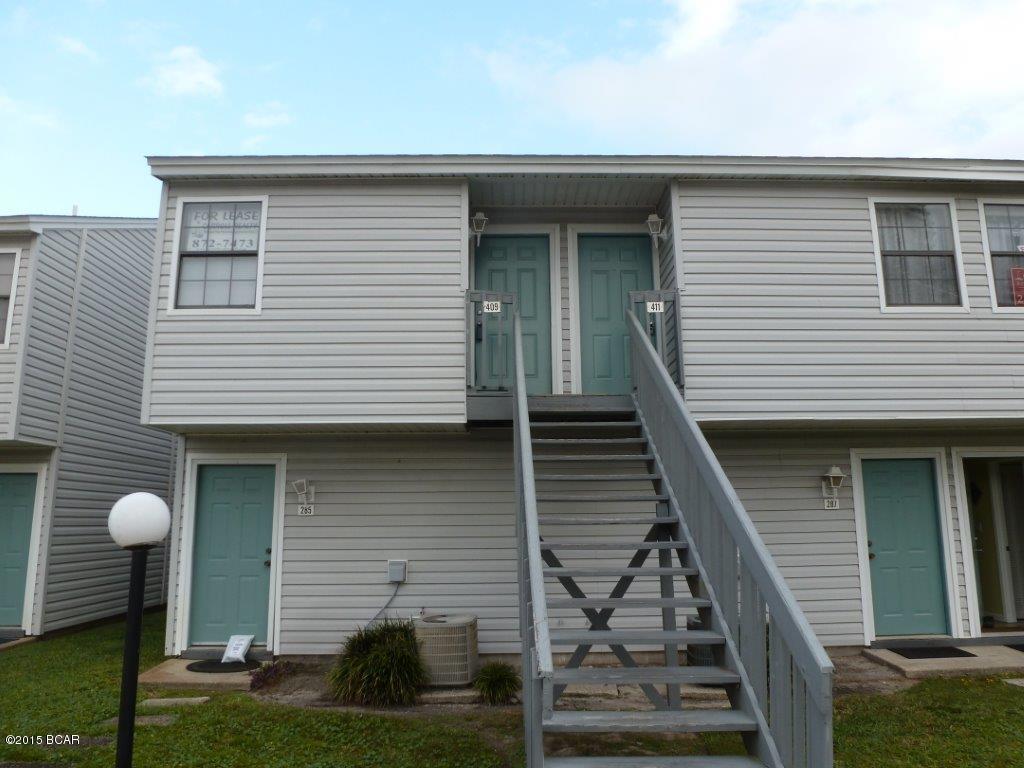 Location, location, location! Waterfront condo on 28 acre Lullwater Lake and across the street from the Gulf and beach access.  Walk to Pier Park and all its wonderful restaurants and amenities. Complex has a nice in ground pool, shuffle board, and dock to fish from.  Open floor plan with a bedroom and full bath on

both levels. The view of the lake is outstanding from the living room, back deck and master bedroom  An efficient Pullman kitchen has dishwasher stove and refrigerator. Living room has wet bar and there is a stackable washer and dryer.  Unit needs some TLC but could be a wonderful place to call home or as an investment property because there is a rental office on site.  Owners are allowed pets but renters are not.  This is not a short sale or foreclosure just an excellent buy. All measurements are estimated so measure to be sure if  it is important to you.