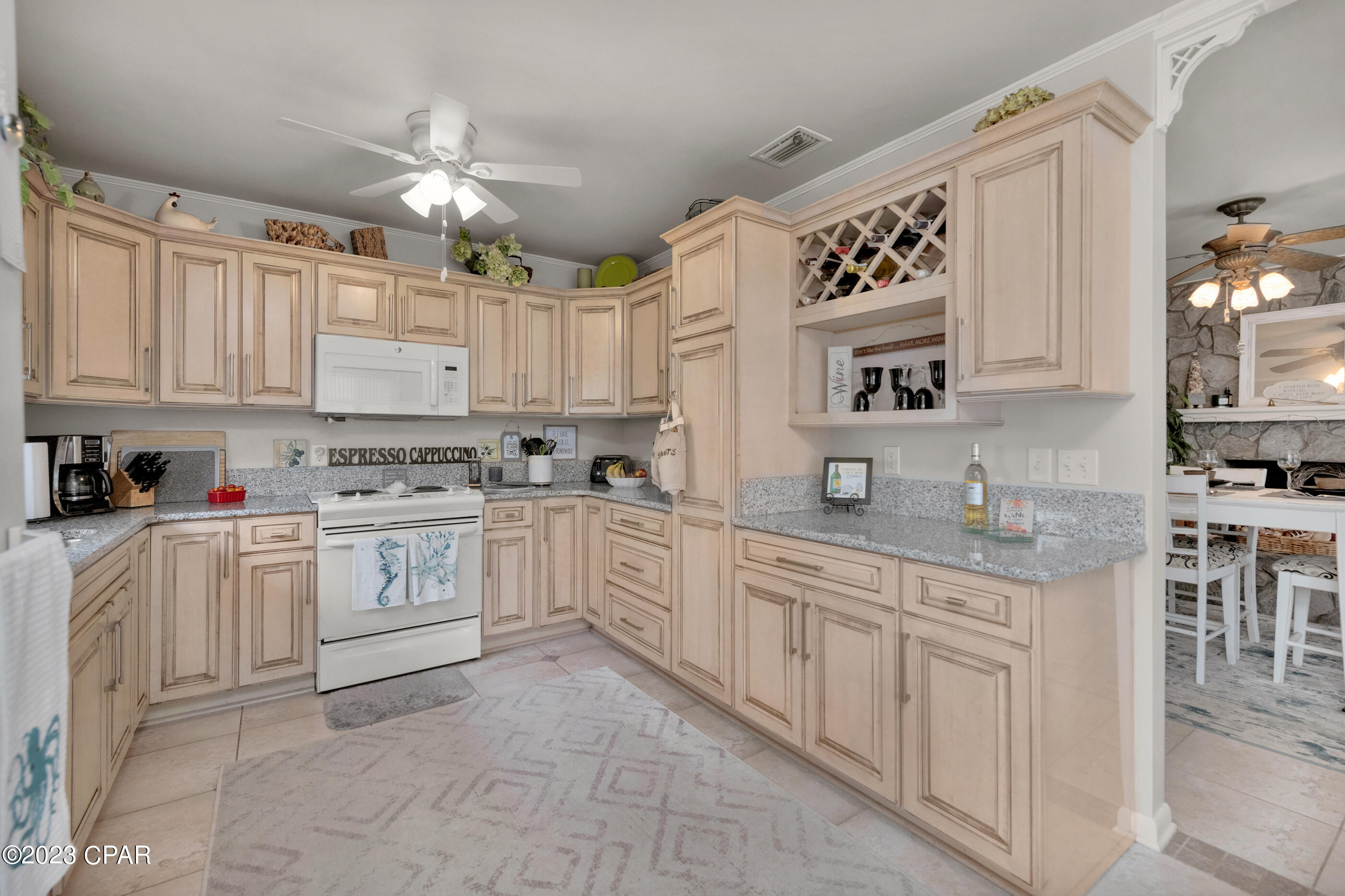 Have you been looking for that perfect 'beach life style' home? Something not too big, tucked away from all the 'noise' from Panama City Beach? Then this home is for you! With vacation rental projects as high as $41k/yr, this cozy two-bedroom home is a short walk or quick golf cart ride to your community's private gulf coast beach access. Enjoy those warm sunrises and breathtaking sunsets day in and day out living your ideal beach life. This home features hurricane doors & windows, glass enclosed sun room, tile flooring throughout, marble tub/shower & bath vanity. The kitchen has custom cabinets with granite counter tops, kitchen pantry w/pull out shelves, lazy Susan in cabinets, and a built-in wine rack. Blinds, shades, curtains, and all appliances remain with the home. Relax under the covered patio off the master suite! The out building includes power & light w/additional outlets, and there's also a well w/ a sprinkler system. There's no HOA, so this could be a perfect investment opportunity those looking to own a vacation rental. Call to schedule a showing today!