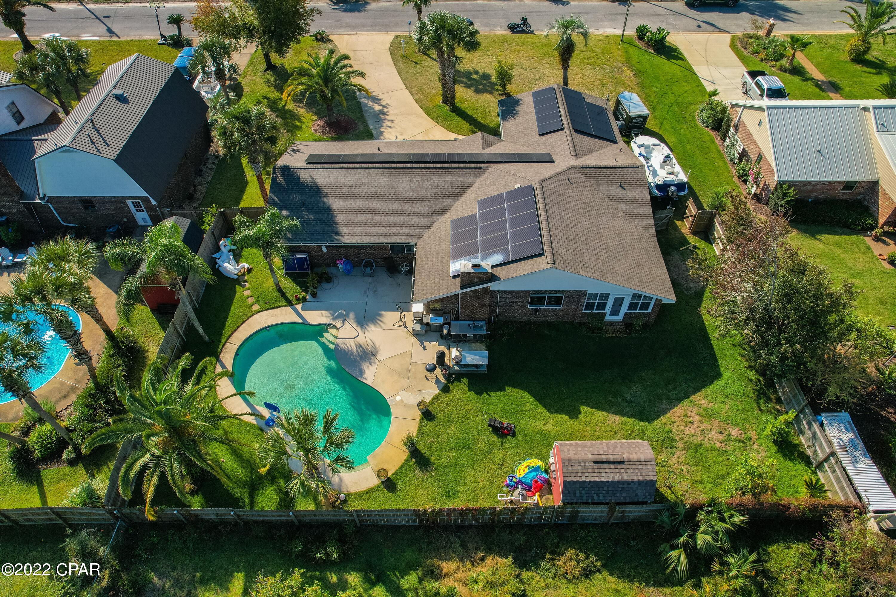 This is the home that feels like home!! Oversized lot, in a quiet neighborhood, nestled in between between 23rd street and HWY 77. You are a stones throw away from shopping and dining, and only a short drive to the beach or Tyndall AFB. This solar powered home (with no loan to assume) has a large Florida room and formal dining area/flex space, in addition to three bedrooms and large living space,  complete with beautifully tiled fireplace. Laze away the summer days in the pool, in your fenced  in yard. This home has been updated, without taking away its original charm. Don't forget to bring the toys, as the large driveway will certainly accommodate your RV/boat, without complaint, as not a HOA in sight.

All information to be verified by buyer.