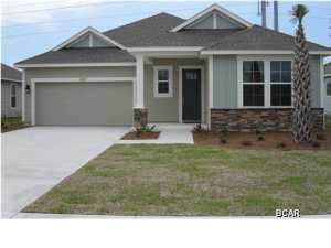 Beautiful new construction home in Whisper Dunes Phase 2A. This home features an Amberjack I floor plan with a Carolina elevation. A Samuel Taylor built home includes standard features such as designer carpet in main areas and bedrooms, 8 ft. 2 panel craftsman interior door package, brushed nickel fixtures and faucets throughout, insulated (R19) interior common walls and insulated (R38) ceilings, and durable Sherwin Williams premium interior wall paint. Kitchen features stainless steel appliance package (range, dishwasher, & microwave) and oversized 36 wood cabinetry with crown molding, and granite counter tops. Full bathrooms include raised vanity heights, large tile flooring in bathrooms and laundry rooms, 2 x 6 Exterior Wall Construction, and hurricane tie down rod anchor