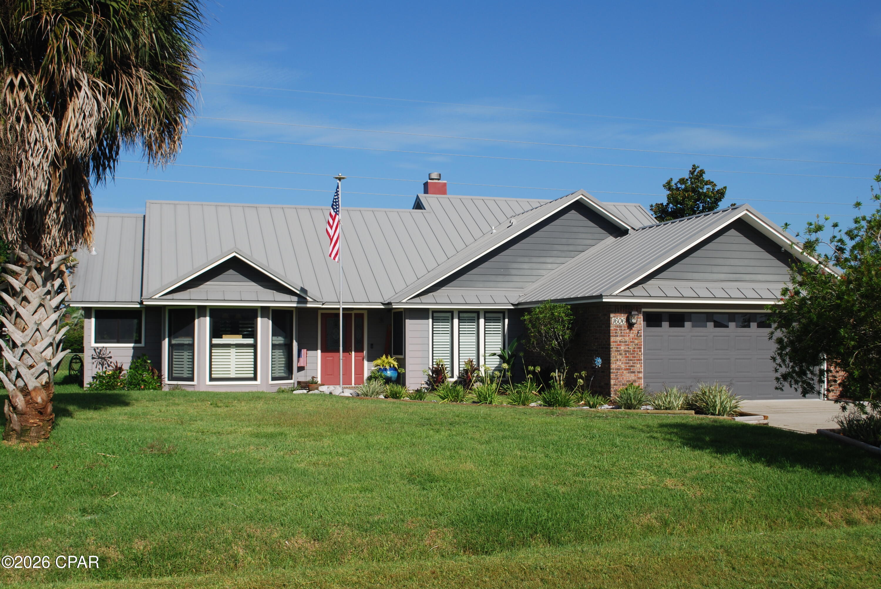 ''Coming Soon No Showings'' LOCATED IN ONE OF THE MOST SOUGHT-AFTER NEIGHBORHOODS IN BAY COUNTY ONLY A FEW MINUTES FROM LYNN HAVEN, TYNDALL AFB, BEACHES, SHOPPING, AND DINING. YOU WON'T FIND A BETTER HOME IN THIS PRICE RANGE. UPGRADES THROUGHOUT THE PROPERTY. LET'S BEGIN IN THE KITCHEN. WITH SOLID OAK CABINETS WITH PULL OUT SHELVES AND SELF CLOSING DRAWERS, CUSTOM OVER AND UNDER CABINET LIGHTING AND GRANITE COUNTERTOPS. UPGRADED STAINLESS STEEL APPLIANCES WITH A CERAMIC COOKTOP WITH HIDEAWAY VENT HOOD, WALL OVEN, SIDE BY SIDE REFRIGERATOR, DISHWASHER, MICROWAVE, AND WARMING DRAWER. IT ALSO HAS A BUILT IN DESK WITH TV MATCHING THE KITCHEN CABINETS. THIS AREA ALSO HAS A FORMAL DINING ROOM WITH WOOD FLOORING AND A BREAKFAST NOOK. THE MASTER BEDROOM AND BATH ARE THE SHOWCASE OF THE HOME. THE BEDROOM IS VERY SPACIOUS WITH A LARGE WALK-IN CLOSET AND WOOD FLOORING. THE MASTER BATH FEATURES A TILED WALK-IN SHOWER WITH DUAL SHOWER HEADS PLUS A HAND-HELD. IT HAS A GRANITE COUNTERTOP WITH TWO SINKS, BIDET, POCKET DOOR, AND SKY LIGHT. THE HALL BATH HAS A JACUZZI TUB WITH CERAMIC TILED SHOWER, GRANITE COUNTERTOP, AND SKYLIGHT. LAUNDRY ROOM INCLUDES A FRONT LOAD WASHER AND DRYER PLUS A FILTERED WATER DISPENSER IN THE LAUNDRY DEEP SINK AND A TIMED WATER HEATER. ALL ROOMS HAVE CROWN MOLDING AND CEILING FANS. FLOORING CONSISTS OF BOTH TRAVERTINE CERAMIC TILE AND REAL WOOD. LIVING ROOM AND FORMAL DINING ROOM HAVE CUSTOM SHUTTERS AND BLINDS, A NATURAL GAS FIREPLACE WITH REMOTE CONTROL AND BUILT IN BLOWER. NUMBER 2 AND 3 BEDROOMS BOTH HAVE DOUBLE CLOSETS. FRONT BEDROOM HAS SECURITY SYSTEM IN THE CLOSET. LET'S TALK ABOUT THE EXTERIOR FEAUTURES. THE PROPERTY HAS 2 GARAGES, ONE ATTACHED AND ONE DETACHED. THE ATTACHED 2 CAR GARAGE FEATURES STORAGE CABINETS, DOOR OPENER, PEG BOARD WALL, AND PULL DOWN STAIRS. THERE IS ALSO A VERSA LIFT TO AID IN PUTTING THINGS IN THE ATTIC WHICH HAS FLOORING.  THE DETACHED 24 X 24 GARAGE/WORKSHOP IS INSULATED AND HAS AIR CONDITIONING, DOOR OPENERS AND TONS OF STORAGE. THE DETACHED GARAGE HAS A COVERED CARPORT WITH CONTINUOUS ROOF WITH THE HOUSE (INSURANCE SAVINGS).IT ALLOWS ADDITIONAL COVERED PARKING. THE EXTERIOR OF THE HOUSE IS A MIXTURE OF BRICK AND HARDI BOARD OVER PLYWOOD IN THE FLAT AREAS. ALL REPLACED IN 2019. FEATURES A STANDING SEAM METAL ROOF INSTALLED IN 2016. ROOF RECEIVED NO DAMAGE FROM HURRICANE MICHAEL. ANDERSON WINDOWS INSTALLED IN 2019 INCLUDING THE DETACHED GARAGE. HAS A 7 CAMERA SECURITY SYSTEM. THE FRONT DOOR ENTRANCE AND MASTER BEDROOM PATIO BOTH HAVE A WOODEN DECK. THERE IS A WOODEN FENCED PATIO WITH PAVER BLOCKS AND NATURAL GAS HOOKUP FOR A GRILL. LANDSCAPING IS MAINTAINED BY A SPRINKLER SYSTEM WITH RAIN SENSOR. BACKYARD HAS A CHAINLINK FENCE WITH PAVERS ON THE PERIMETER FOR PET SECURITY. THERE ARE NO HOA FEES. YOU HAVE AT LEAST 20' FROM EACH SIDE NEIGHBOR, AND NO HOME TO THE REAR. YOUR MAILBOX IS AT THE FRONT OF THE HOUSE. YOU EVEN GET YOUR OWN FLAGPOLE.