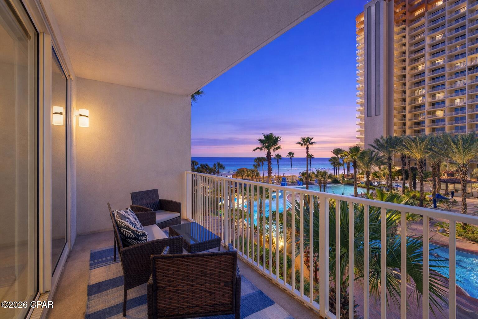 Deeded Garage Space on the same  floor of unit.  No elevators necessary. This highly sought-after low-floor unit features one of the best 2-bedroom floor plans at Shores of Panama--and lives like a 3-bedroom. The spacious bunk room is a true enclosed room with a door and window, offering added privacy and flexibility for guests.

Designed for both comfort and views, the Gulf-front primary suite and living area open directly onto an extra-wide private balcony through sliding glass doors. Enjoy breathtaking Gulf views, coastal breezes, and the soothing sound of the waves right from your living space.

This unique layout includes a Gulf-view primary suite with private bath and balcony access, a second suite with its own bath, a private bunk room, and an additional guest bathroom--providing ideal accommodations for owners and guests alike. The open-concept living area features a fully equipped kitchen, breakfast bar, and dining space perfect for entertaining.

Offered fully furnished and turnkey, the condo showcases attractive plank flooring, coastal-inspired colors, and quality finishes throughout. Step onto the balcony to take in stunning pool views along with glimpses of turquoise waters and sugar-white sand.

A rare highlight of this property is the deeded parking space located on the same (3rd) floor--no elevators needed--providing unmatched convenience and easy access. Low-floor units like this are rarely available, allowing you to skip elevator wait times with just a short walk up two flights of stairs.

Shores of Panama offers resort-style amenities including a spectacular zero-entry pool, tiki bars, hot tubs, indoor pool, sauna, steam rooms, fitness center, and on-site snack shop with coffee, donuts, and ice cream.

Ideally located next to Pineapple Willy's and just minutes from Pier Park, Topgolf, and Pirate's Voyage, this condo puts you in the heart of Panama City Beach's best dining, shopping, and entertainment.

With its exceptional layout, stunning views, and unbeatable convenience, this property is a must-see.