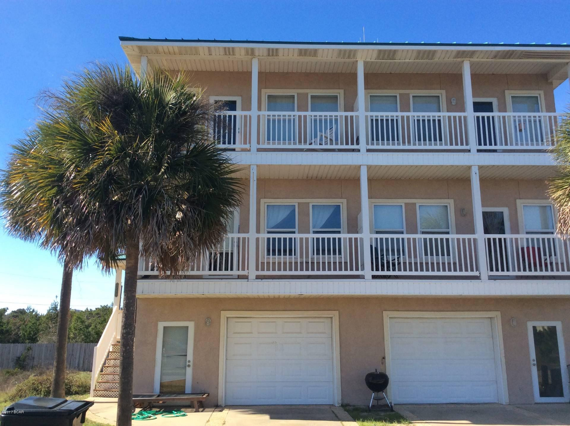 3 story townhome with elevator; lower level is garage, bonus room, middle level is kitchen, dining, living, 1 bedroom and bath, top level 2 bedrooms and 2 baths.