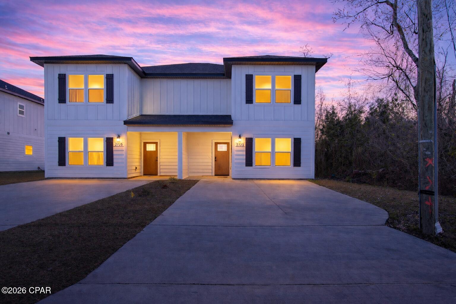 Looking for a new construction home in Panama City, FL with no HOA and short-term rentals allowed? This beautifully designed townhome offers the perfect combination of modern style, low-maintenance living, and investment potential. Whether you're searching for a primary residence, vacation home, Airbnb, or long-term rental property, this home checks every box. Conveniently located just minutes from Highway 231, you'll enjoy quick access to shopping, grocery stores, restaurants, schools, medical facilities, and everyday conveniences. Tyndall Air Force Base is only 18 minutes away, while the white-sand beaches of Panama City Beach are approximately 20 minutes from your doorstep. Unlike many townhomes, this spacious floor plan lives like a single-family home with an open-concept layout designed for both entertaining and everyday living. Luxury vinyl plank flooring flows throughout the main living areas, creating a seamless, modern look with easy maintenance. The chef-inspired kitchen is the heart of the home, featuring white shaker cabinetry with soft-close drawers, quartz countertops, stainless steel appliances, a large center island with bar seating, and a generous walk-in pantry--perfect for hosting family and friends. One of the home's standout features is the rare first-floor bedroom with direct access to a full bathroom, making it ideal for guests, multi-generational living, or a private home office. The spacious living and dining areas flow effortlessly to the covered back porch, providing the perfect space for relaxing, grilling, or enjoying Florida evenings. Upstairs, the private split-bedroom layout offers exceptional comfort. The oversized primary suite measures approximately 13'7'' x 15'8'' and features a large walk-in closet and a beautifully appointed en-suite bathroom with dual vanities and quartz countertops. Two additional generously sized bedrooms, another full bathroom, and a conveniently located upstairs laundry room complete the second floor. Built for lasting quality and energy efficiency, this home includes Hardie® Board siding, a Rheem® tankless water heater, a fully sodded yard, a one-year builder warranty, and a 10-year structural warranty, providing peace of mind for years to come. With no HOA, short-term rentals permitted, premium finishes, and an unbeatable location near Tyndall Air Force Base, Panama City Beach, and Highway 231, this move-in-ready new construction home is an outstanding opportunity for homeowners and investors alike.