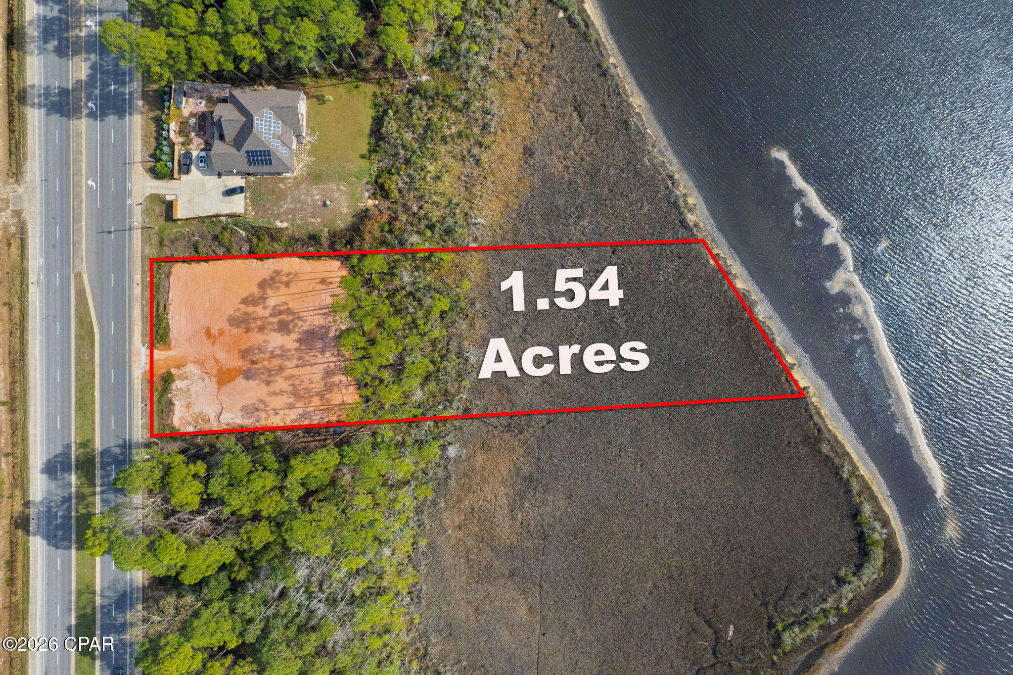 Life awaits on this fabulous build-ready waterfront lot on East Bay in Holley/Navarre. With over 1.5 acres and approximately 150 feet of waterfront footage, this rare opportunity offers the perfect setting to build your dream coastal retreat. Enjoy breathtaking views, free dolphin shows, abundant waterfowl, and soaring osprey right from your own backyard.

The lot has been cleared, filled, and raised per Santa Rosa County permit requirements, making it ready to begin construction. Impact fees have been paid. Approved permits are in place, utility charges for water and fire services have been paid, and builder plans are included with the sale, saving valuable time and expense for the future owner.

The included home plans feature a spacious waterfront design with 5 bedrooms, 5+ bathrooms, and both upstairs and downstairs family rooms, offering ample space and privacy for guests or multi generational living.

Located conveniently on Highway 87 in Navarre, this property is not part of a subdivision, meaning no HOA and no association dues. A truly exceptional opportunity to create your custom waterfront dream home on East Bay.